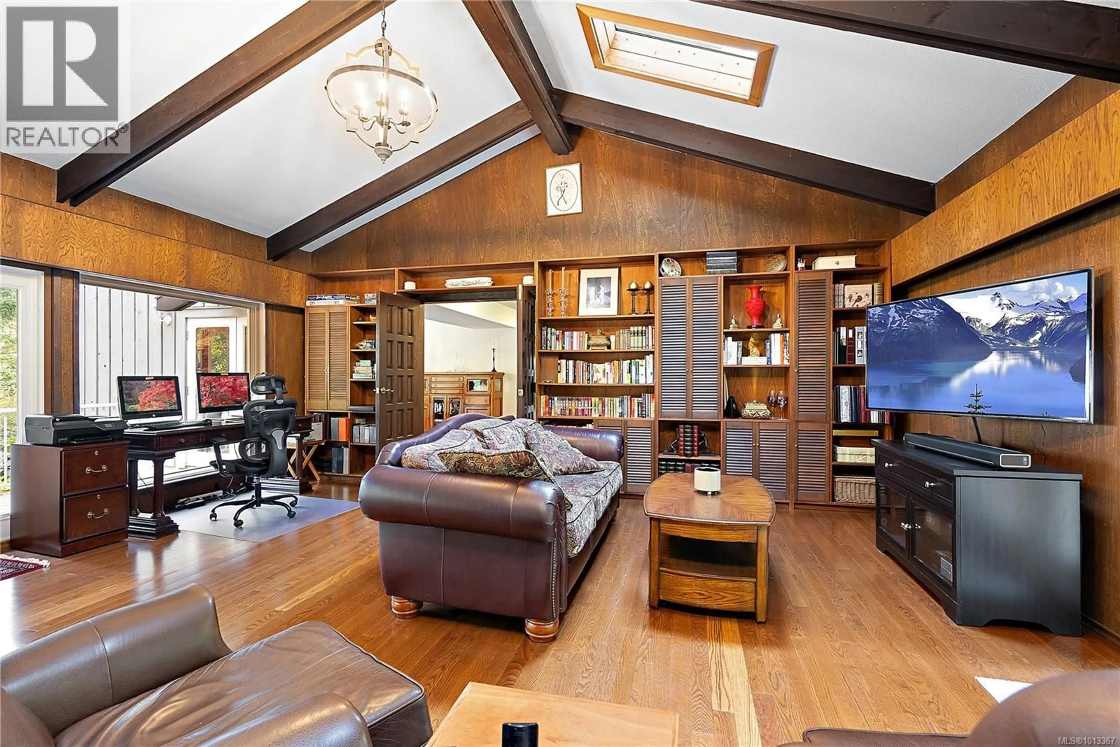 Living room with furniture, wood/laminate floor for 1661 LANDS END ROAD, North Saanich British Columbia V8L5L5