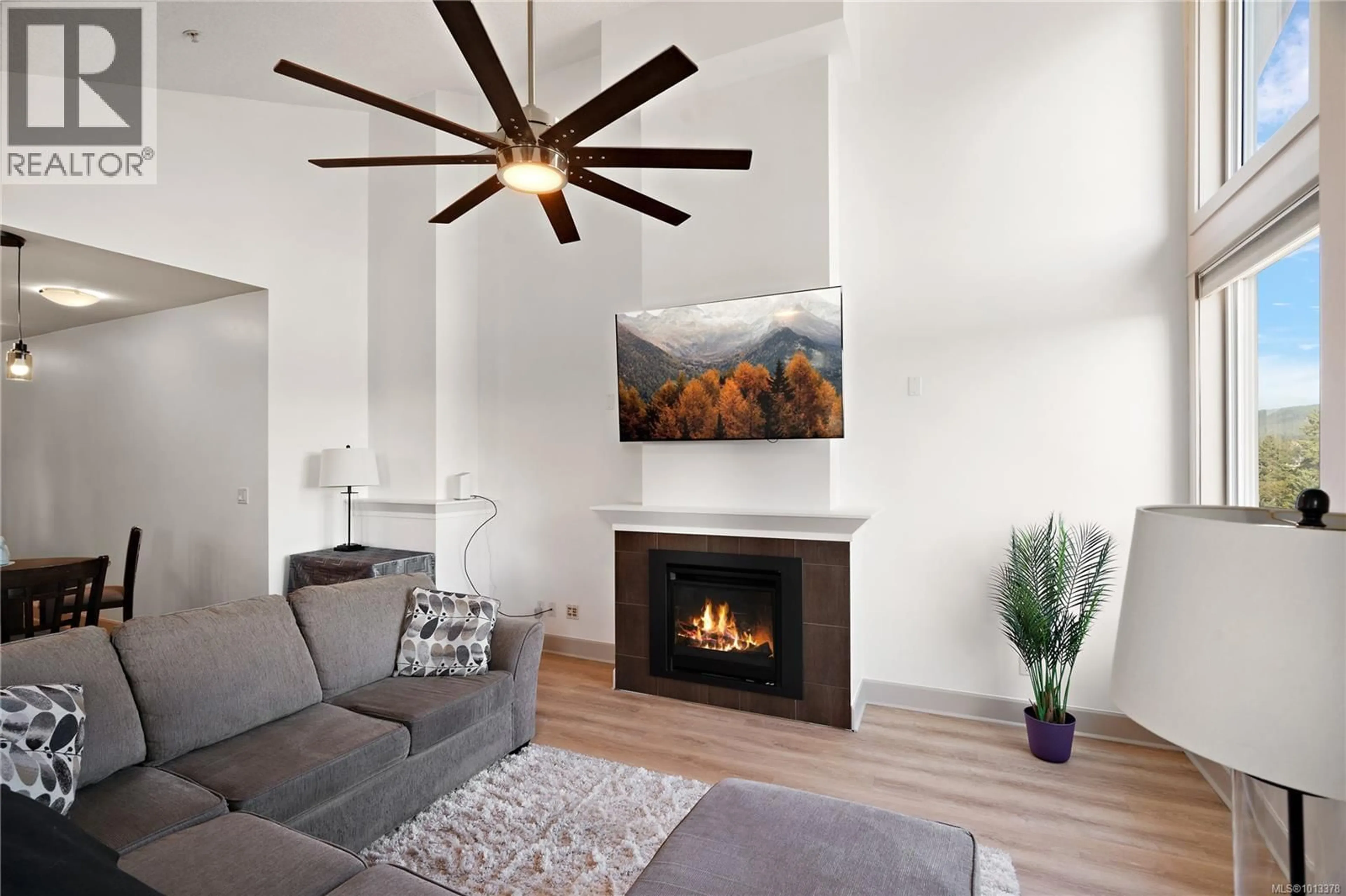 Living room with furniture, wood/laminate floor for 308 - 3210 JACKLIN ROAD, Langford British Columbia V9B0J5