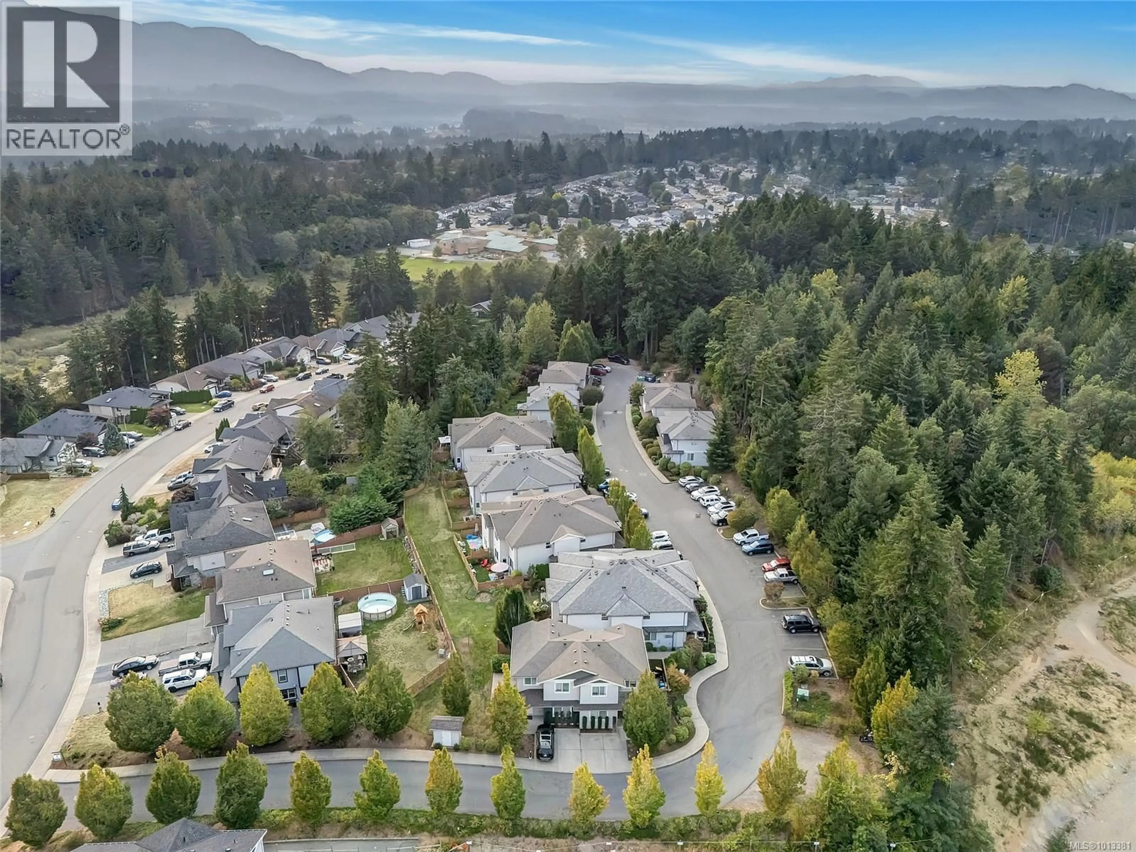 A pic from outside/outdoor area/front of a property/back of a property/a pic from drone, mountain view for 102 - 2153 RIDGEMONT PLACE, Nanaimo British Columbia V9T0C8