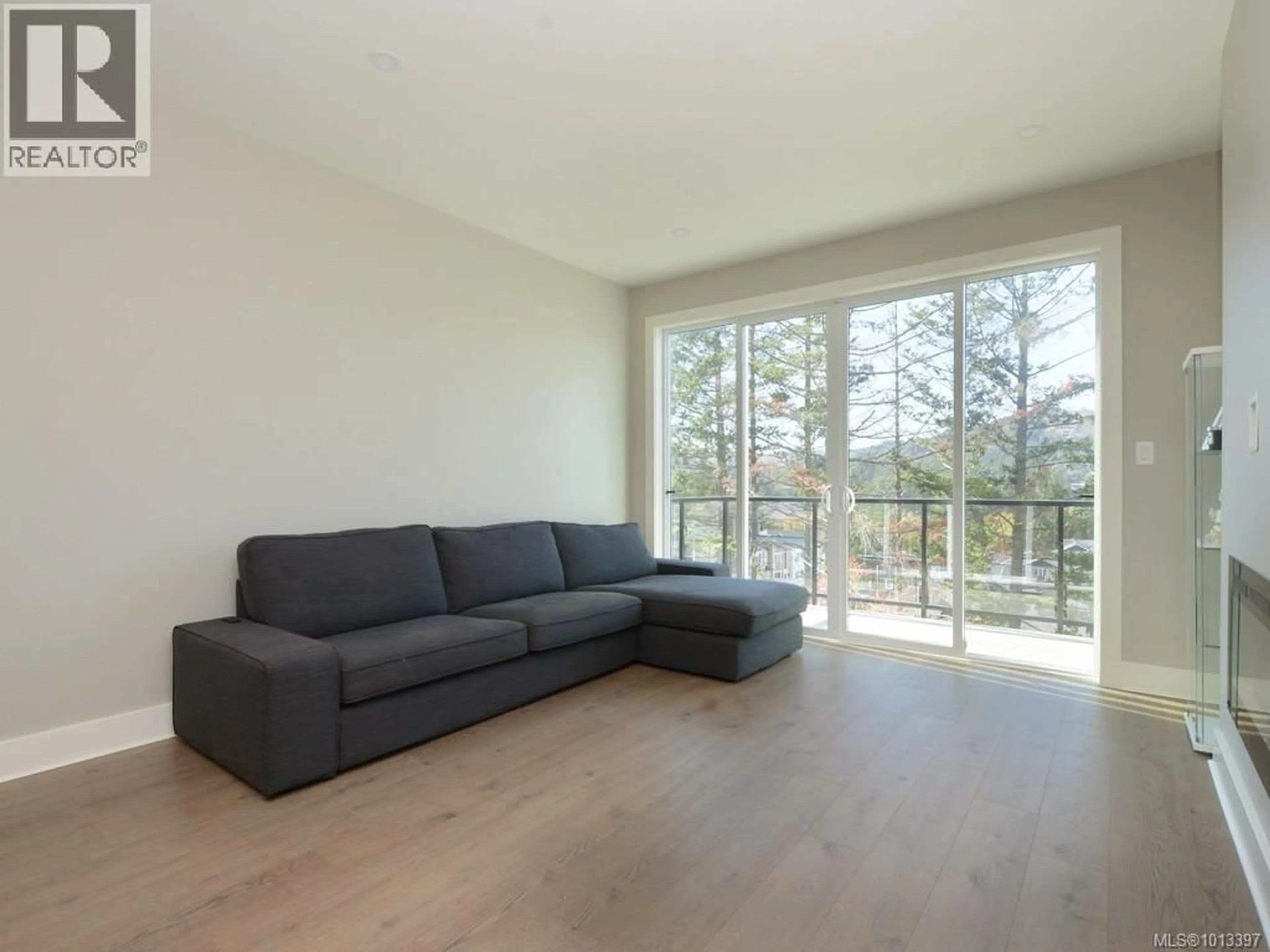 Living room with furniture, wood/laminate floor for 948 WARBLER CLOSE, Langford British Columbia V9C0J4