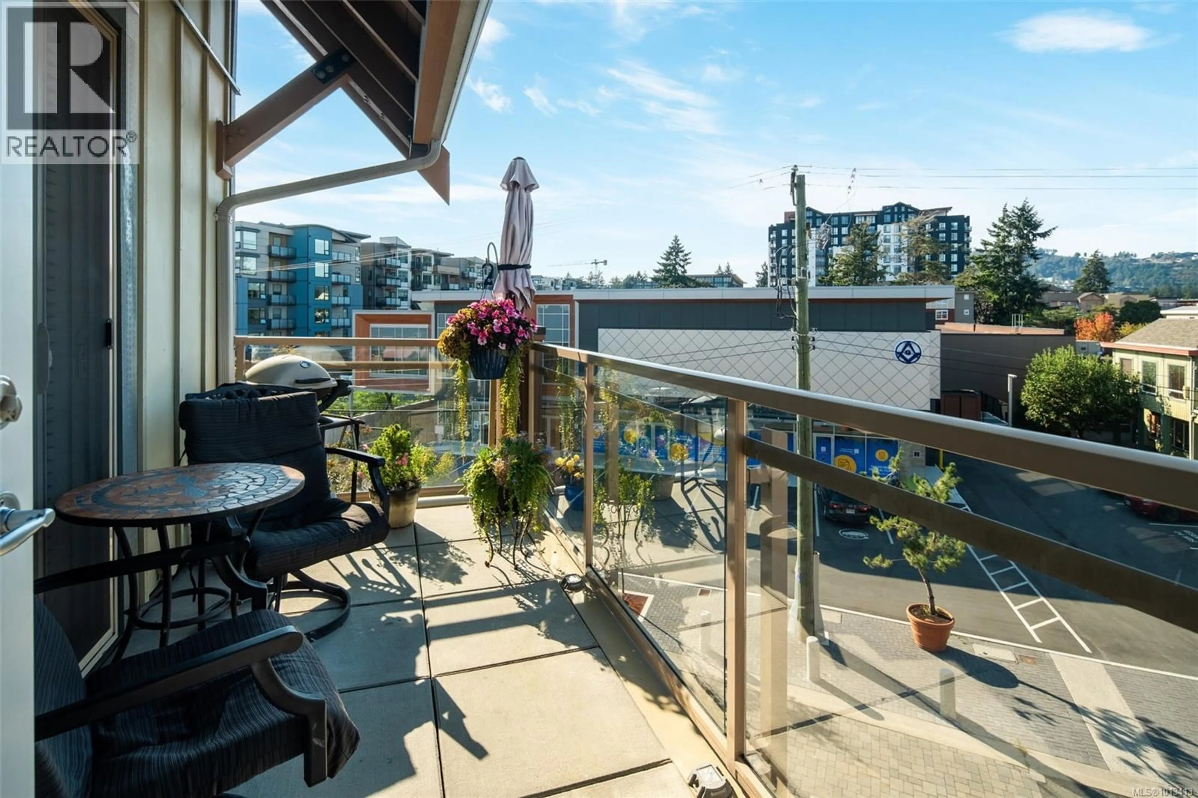 Balcony in the apartment, city buildings view from balcony for 308 - 751 GOLDSTREAM AVENUE, Langford British Columbia V9B2X4