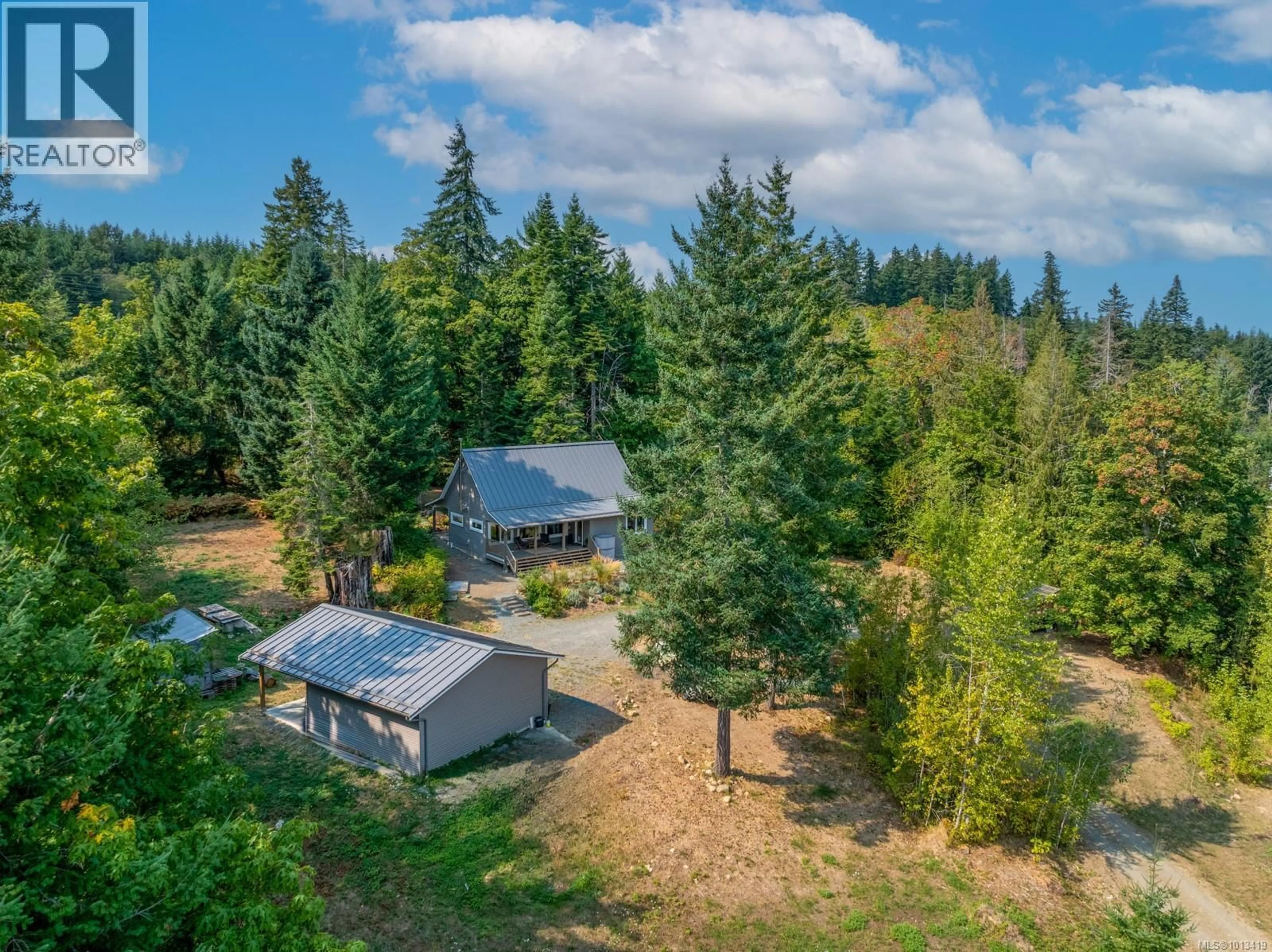 A pic from outside/outdoor area/front of a property/back of a property/a pic from drone, forest/trees view for 6531 COUNTRY ROAD, Fanny Bay British Columbia V0R1W0