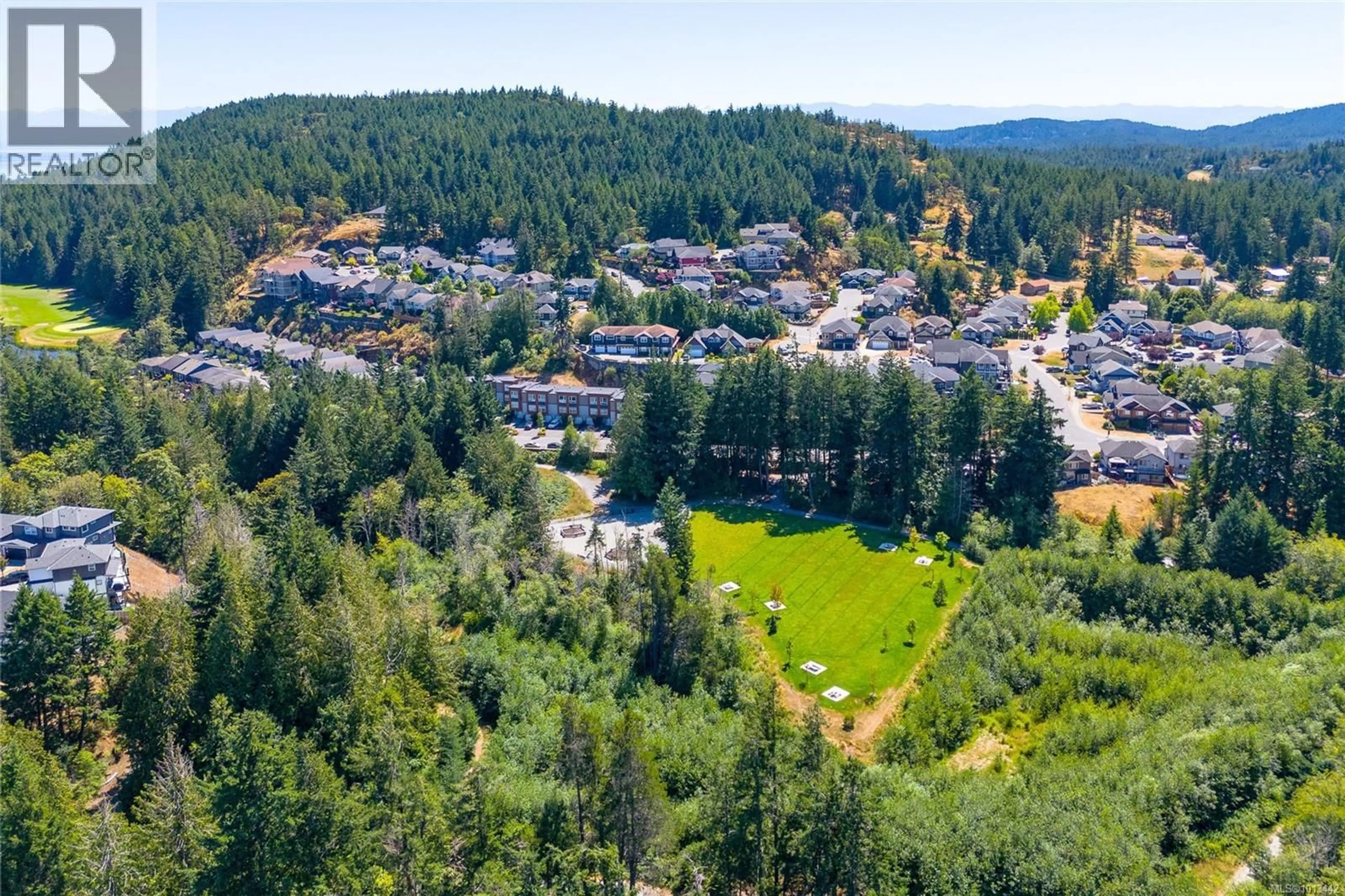A pic from outside/outdoor area/front of a property/back of a property/a pic from drone, forest/trees view for 127 - 933 WILD RIDGE WAY, Langford British Columbia V9C0H1
