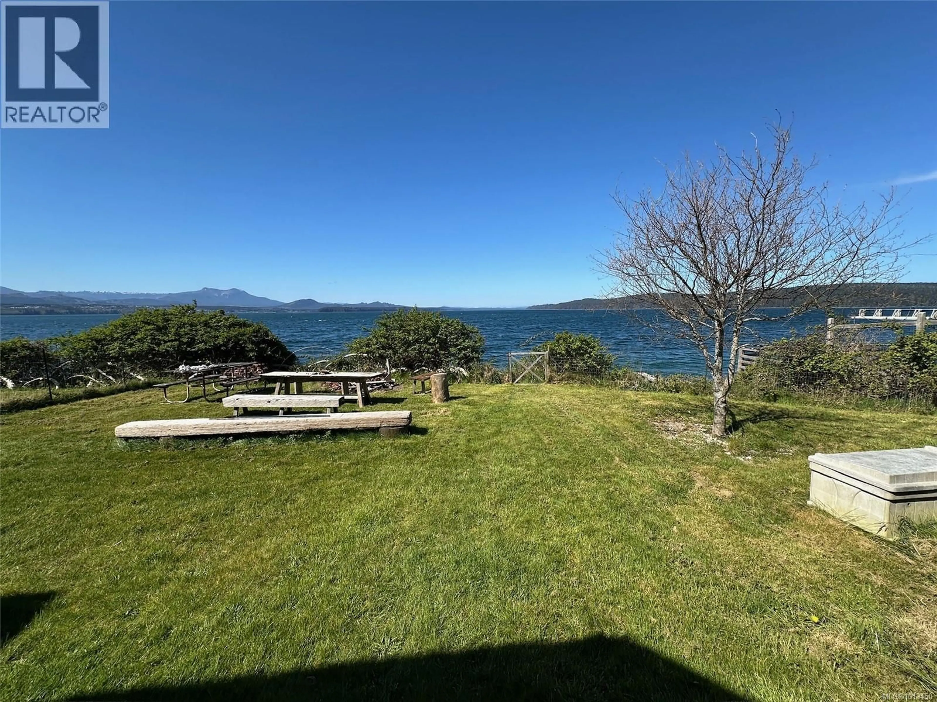 A pic from outside/outdoor area/front of a property/back of a property/a pic from drone, water/lake/river/ocean view for 90 1ST STREET, Sointula British Columbia V0N3E0