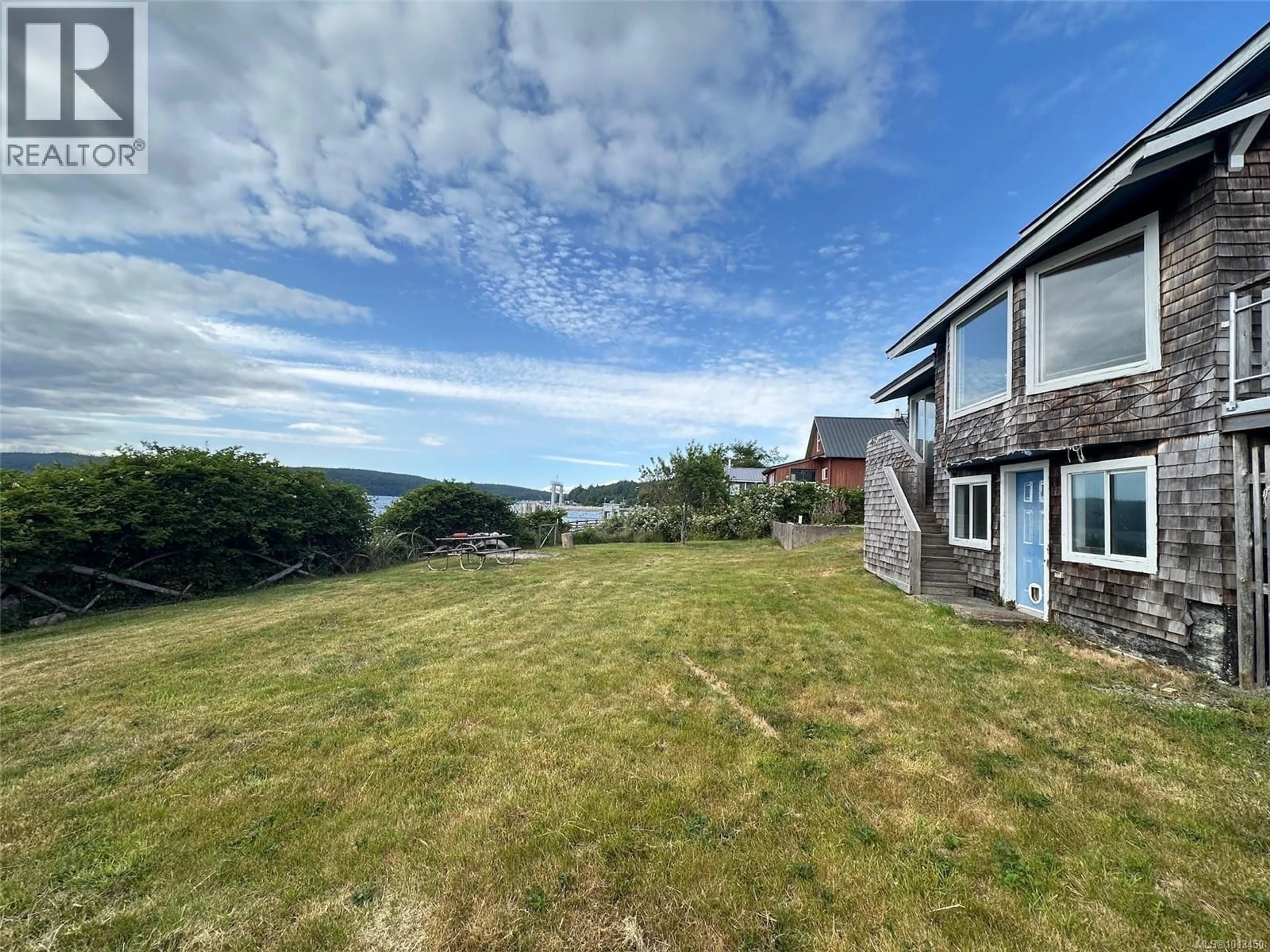 A pic from outside/outdoor area/front of a property/back of a property/a pic from drone, water/lake/river/ocean view for 90 1ST STREET, Sointula British Columbia V0N3E0