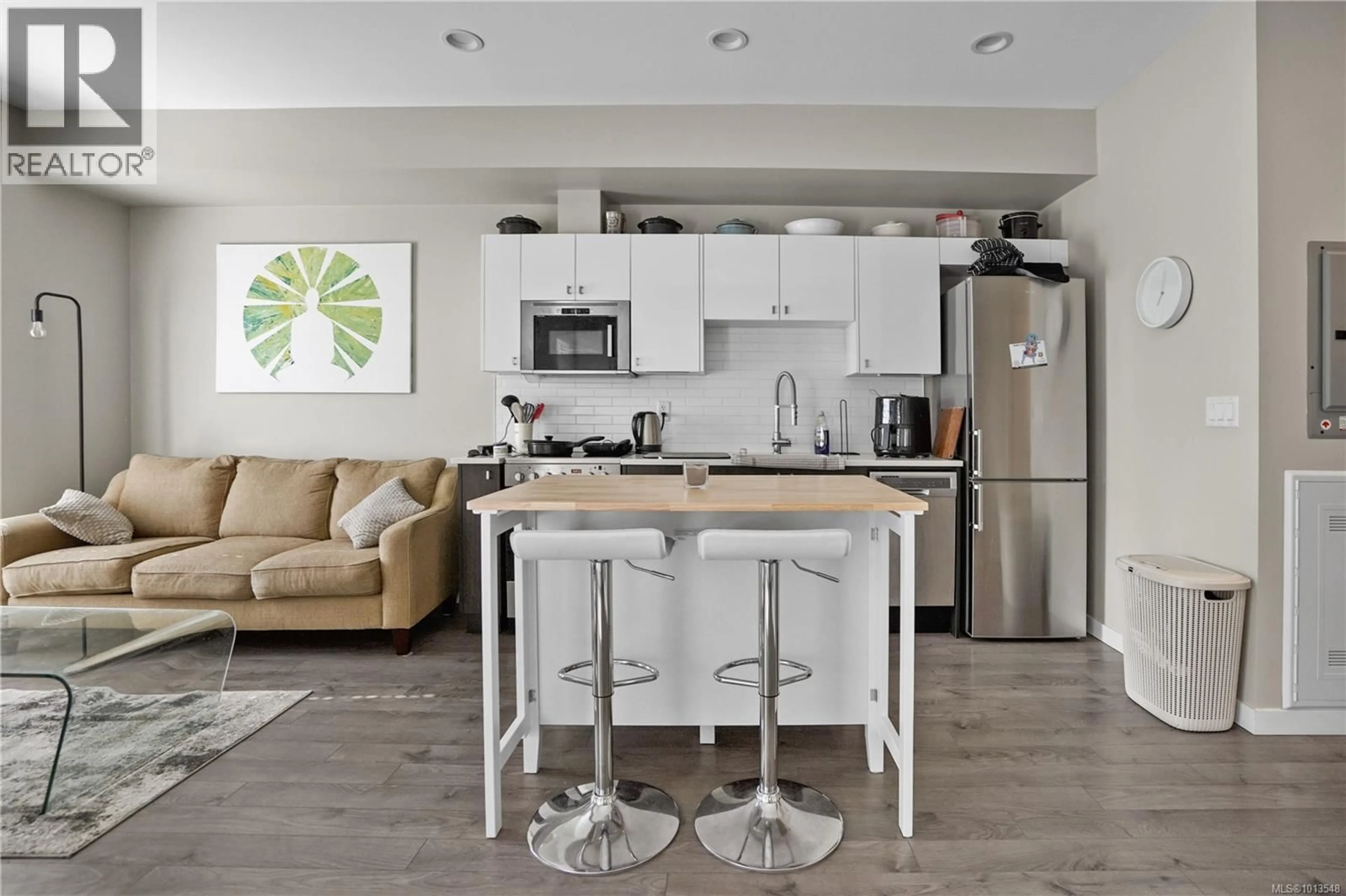 Open concept kitchen, wood/laminate floor for 201 - 767 TYEE ROAD, Victoria British Columbia V9A0G5