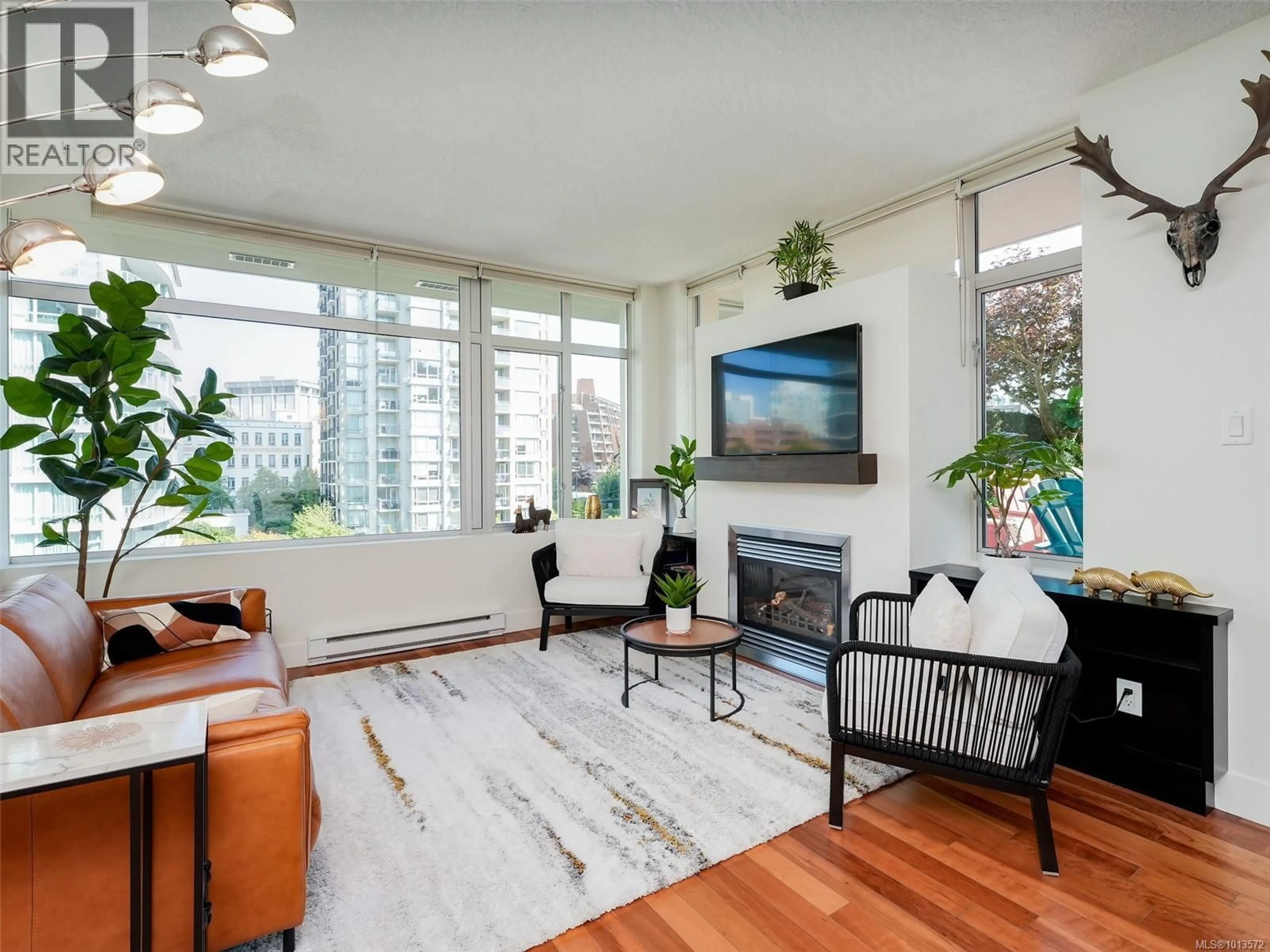 Living room with furniture, wood/laminate floor for N608 - 737 HUMBOLDT STREET, Victoria British Columbia V8W1B1