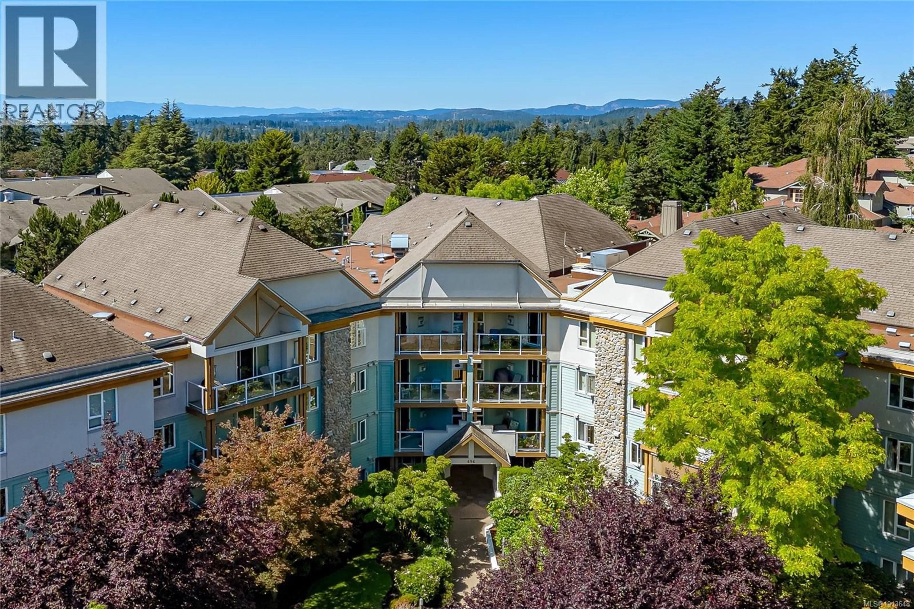 A pic from outside/outdoor area/front of a property/back of a property/a pic from drone, mountain view for 211 - 494 MARSETT PLACE, Saanich British Columbia V8Z7J1