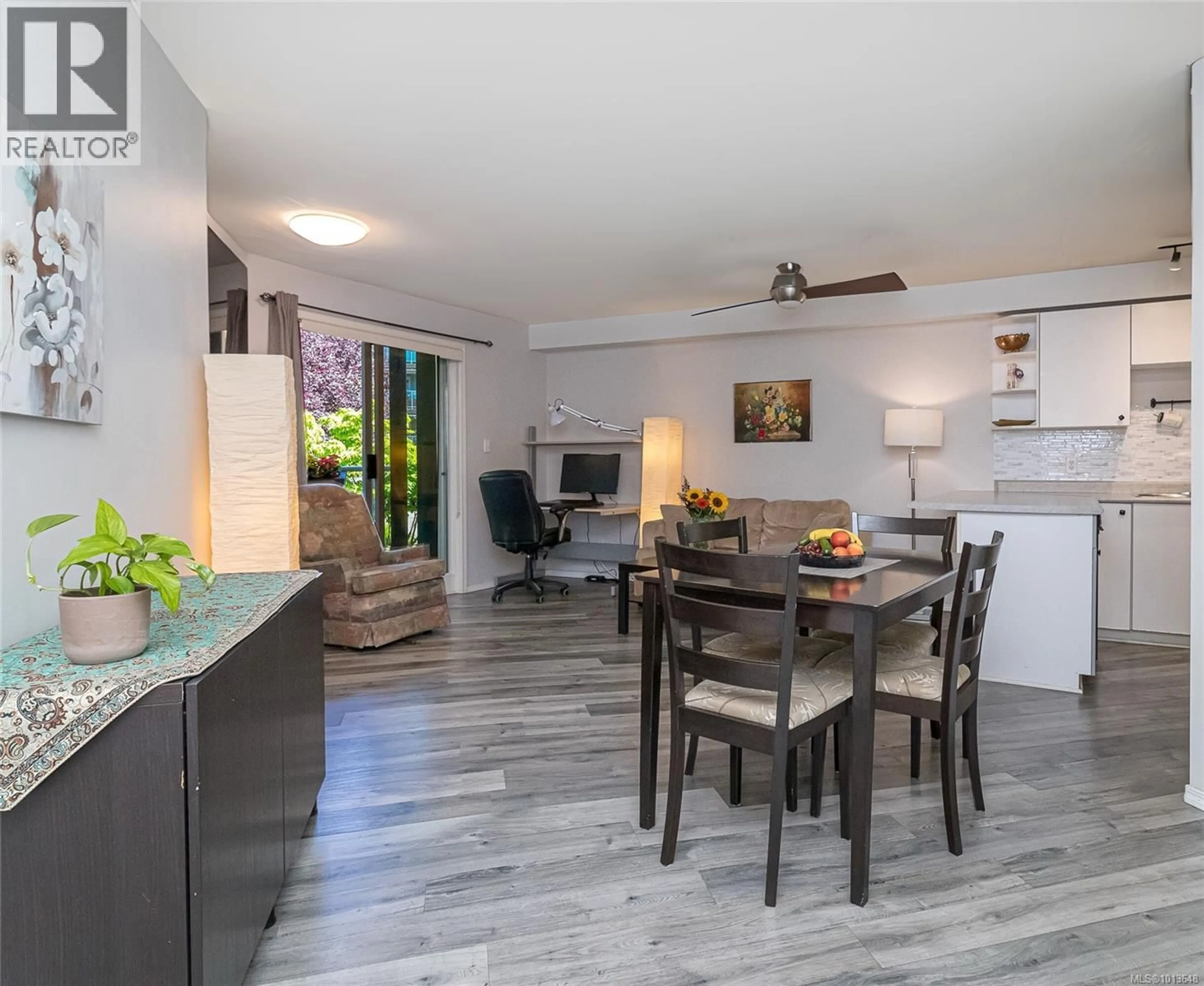 Open concept kitchen, wood/laminate floor for 211 - 494 MARSETT PLACE, Saanich British Columbia V8Z7J1