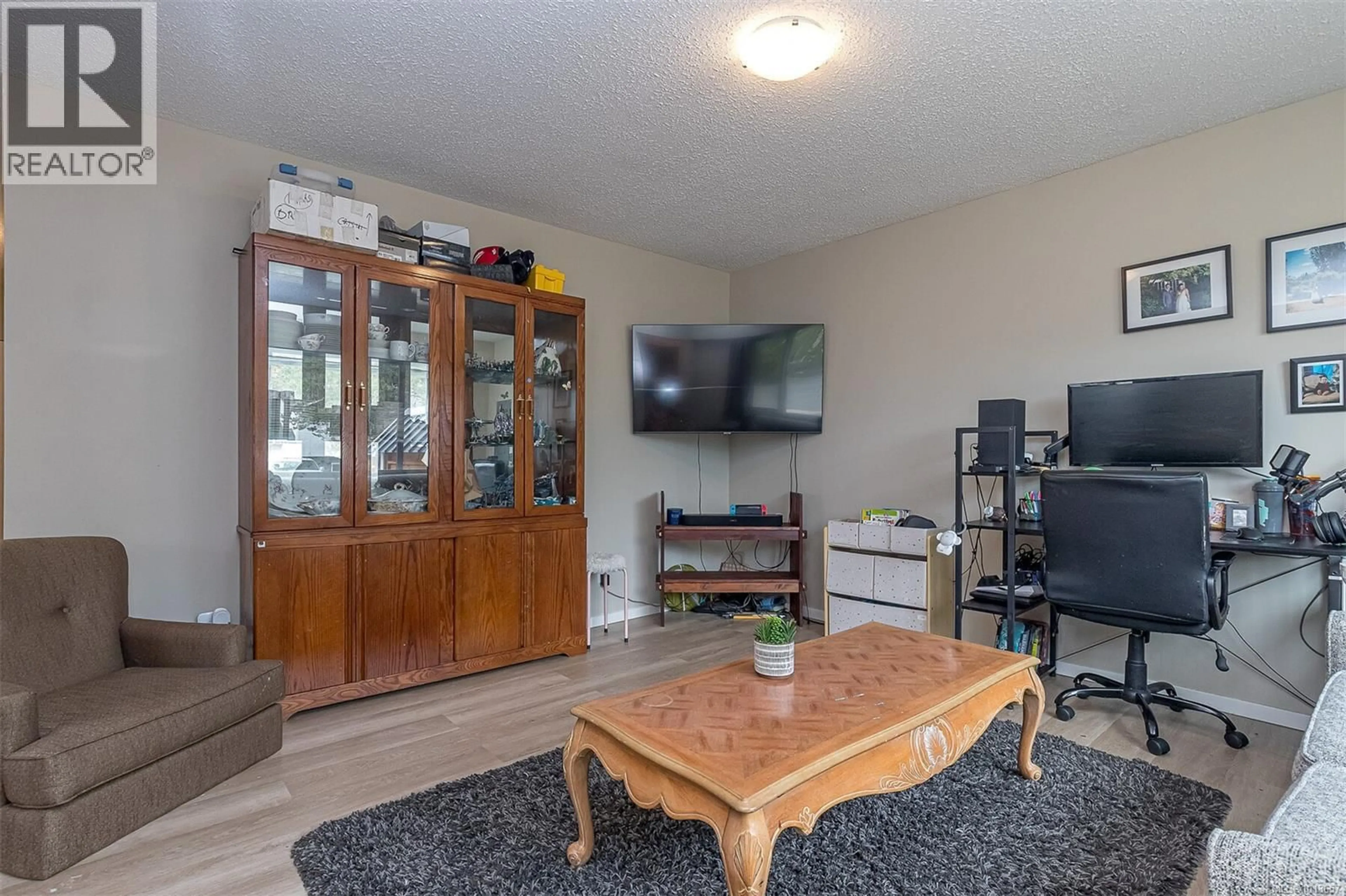Living room with furniture, wood/laminate floor for AMELIA AVENUE, Sidney British Columbia V8L2H5