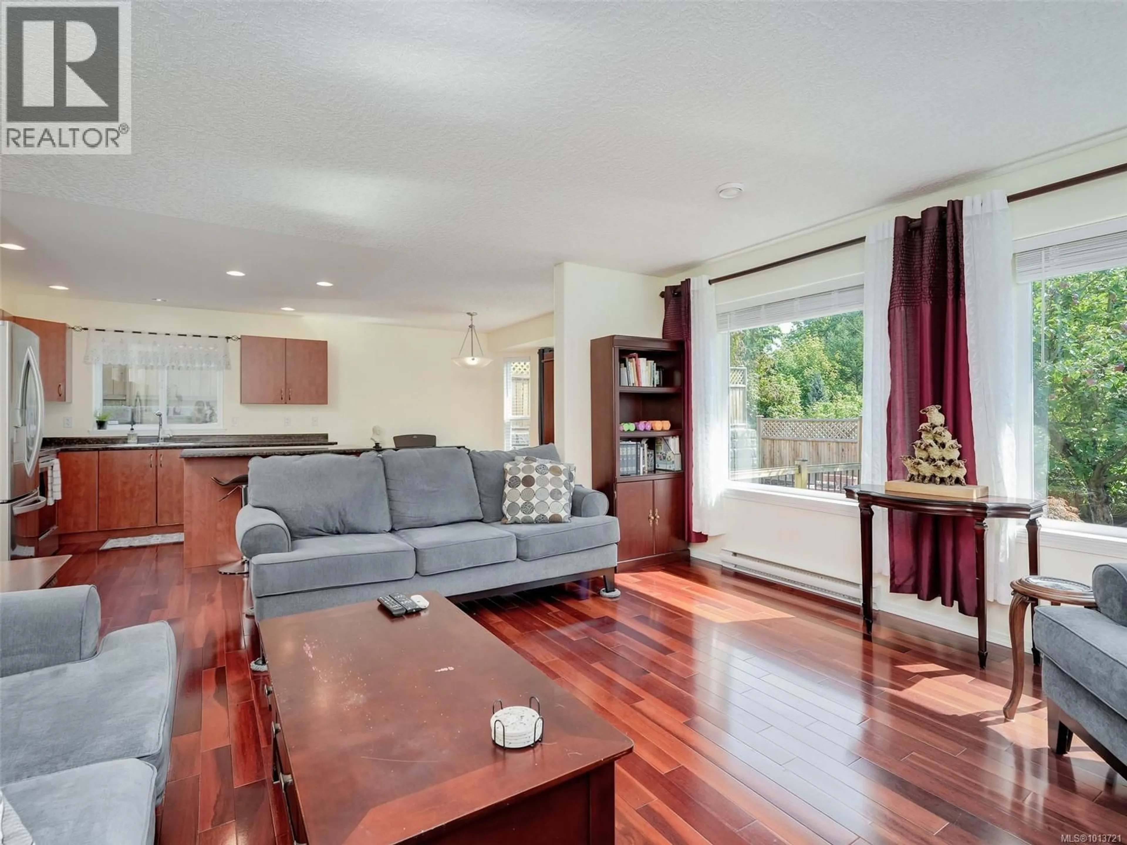 Living room with furniture, wood/laminate floor for 6721 CHARLENE PLACE, Sooke British Columbia V9Z0H4