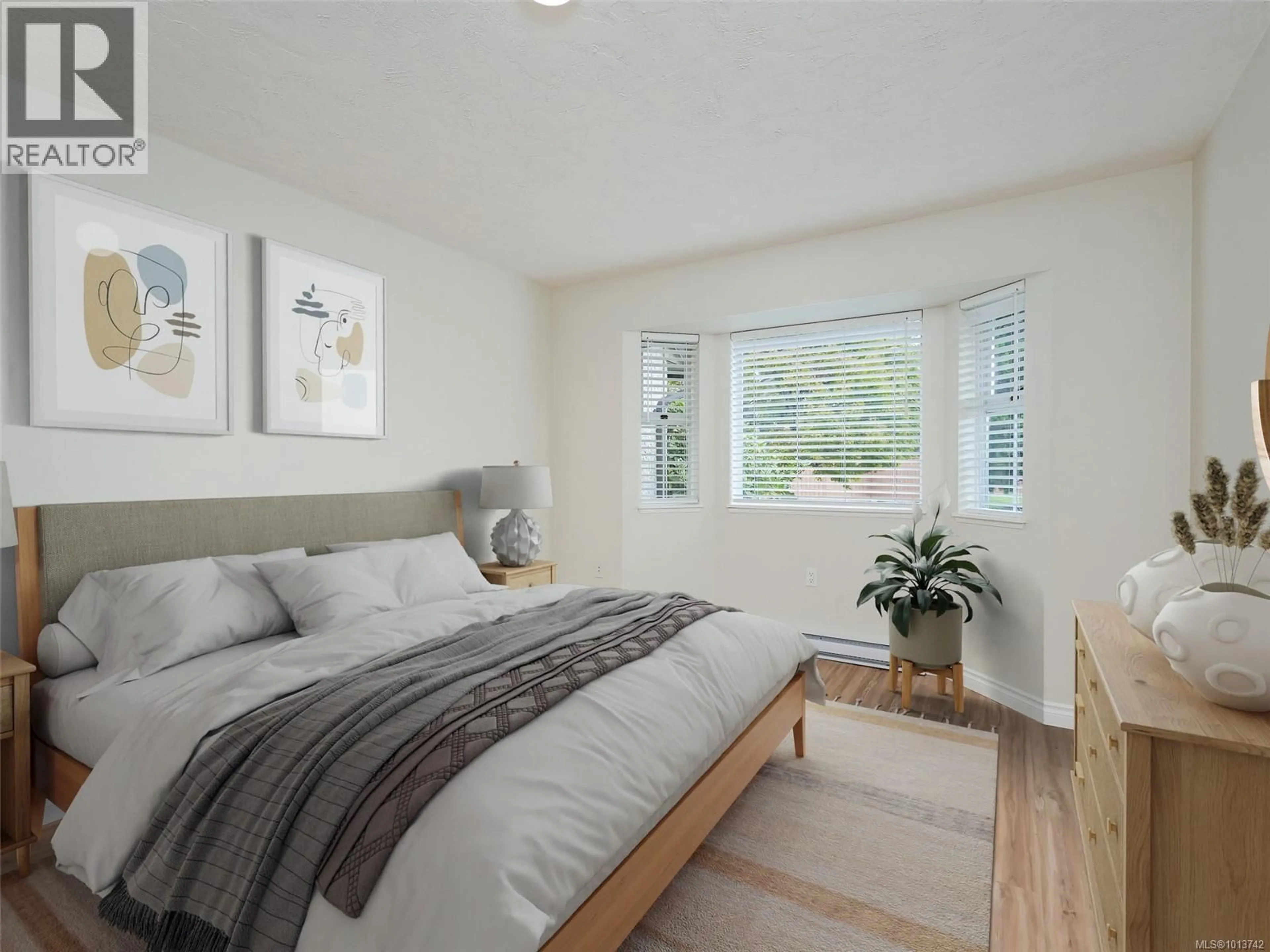 Bedroom with bed, wood/laminate floor for 45 - 2070 AMELIA AVENUE, Sidney British Columbia V8L4X6