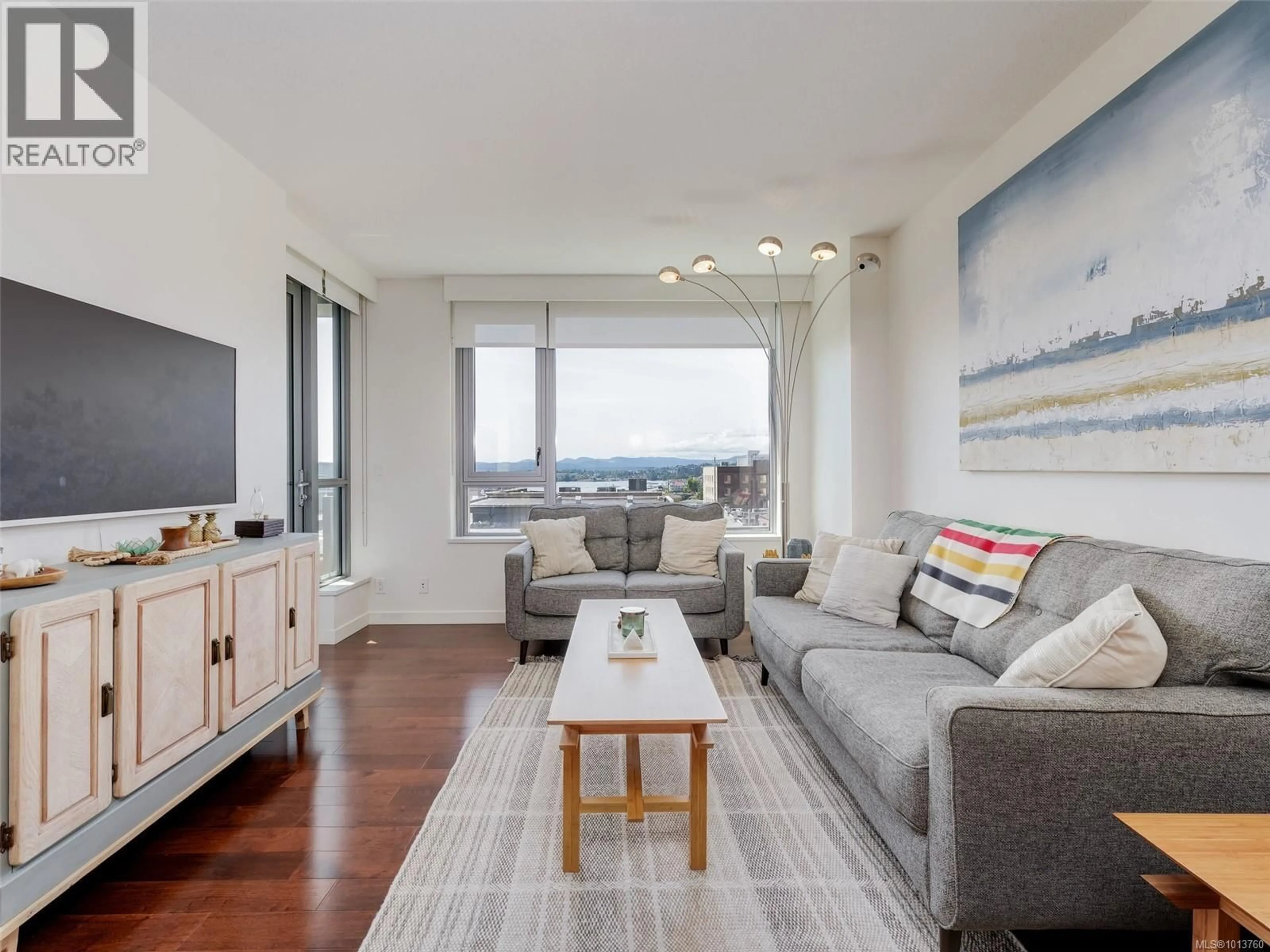 Living room with furniture, wood/laminate floor for 603 - 608 BROUGHTON STREET, Victoria British Columbia V8W1C7