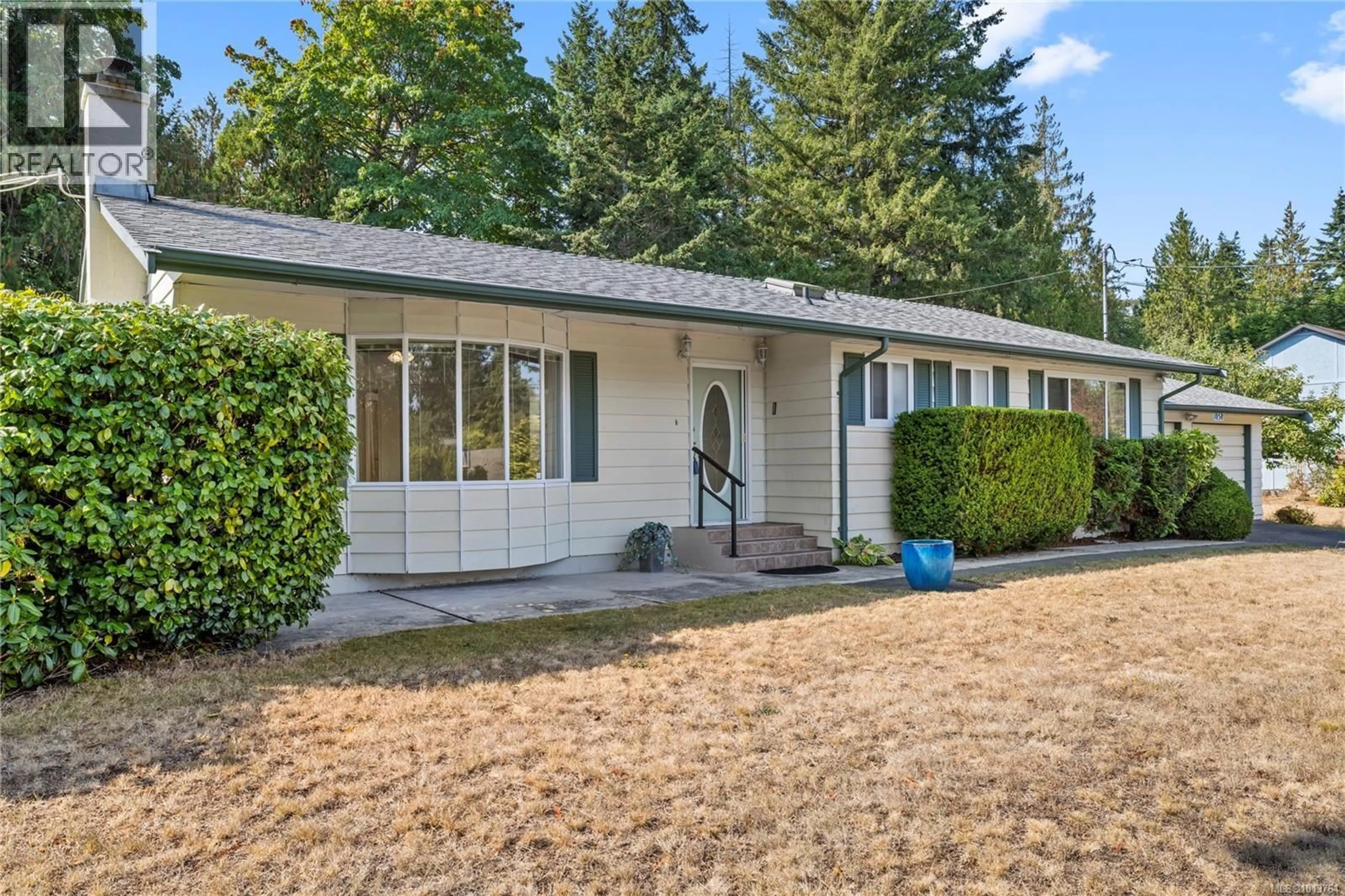 Home with vinyl exterior material, street for 1058 WOOD DUCK PLACE, Qualicum Beach British Columbia V9K1E2