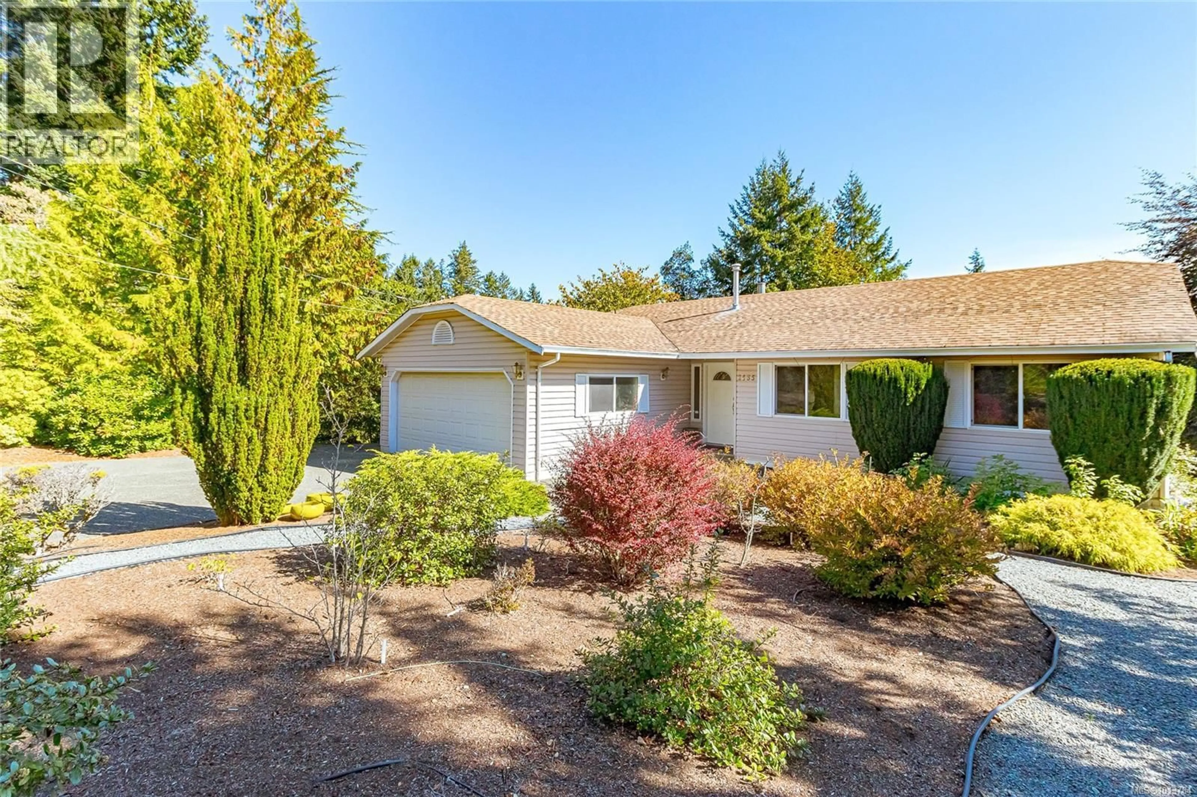 Home with vinyl exterior material, street for 2435 HUCKLEBERRY ROAD, Mill Bay British Columbia V8H1C4