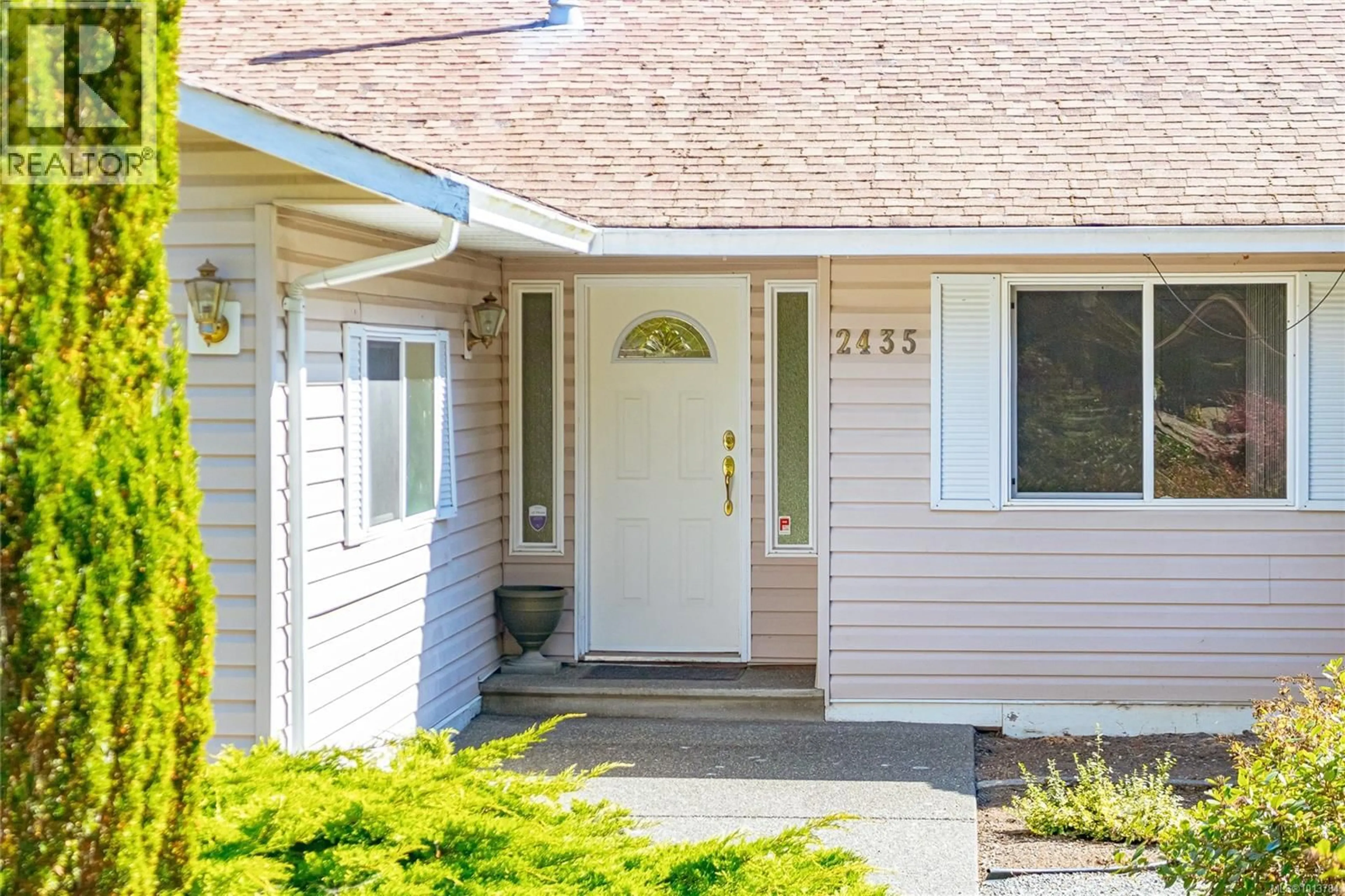 Home with vinyl exterior material, street for 2435 HUCKLEBERRY ROAD, Mill Bay British Columbia V8H1C4