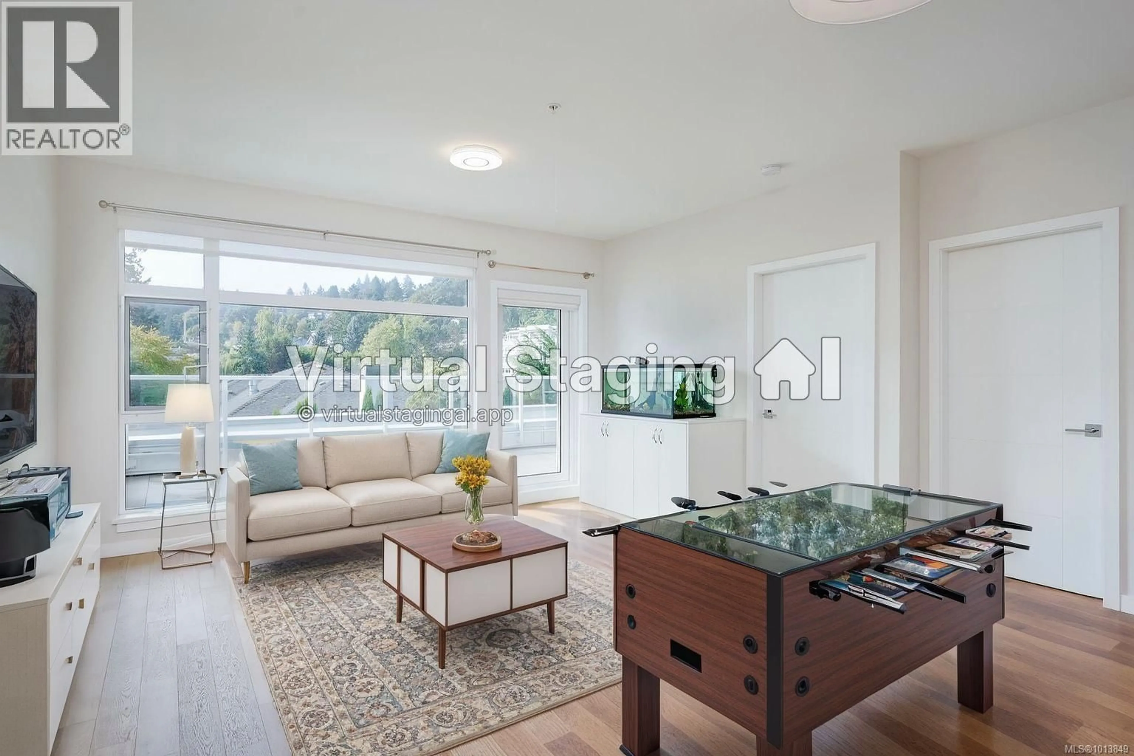 Living room with furniture, wood/laminate floor for 212 - 5120 CORDOVA BAY ROAD, Saanich British Columbia V8Y2K5