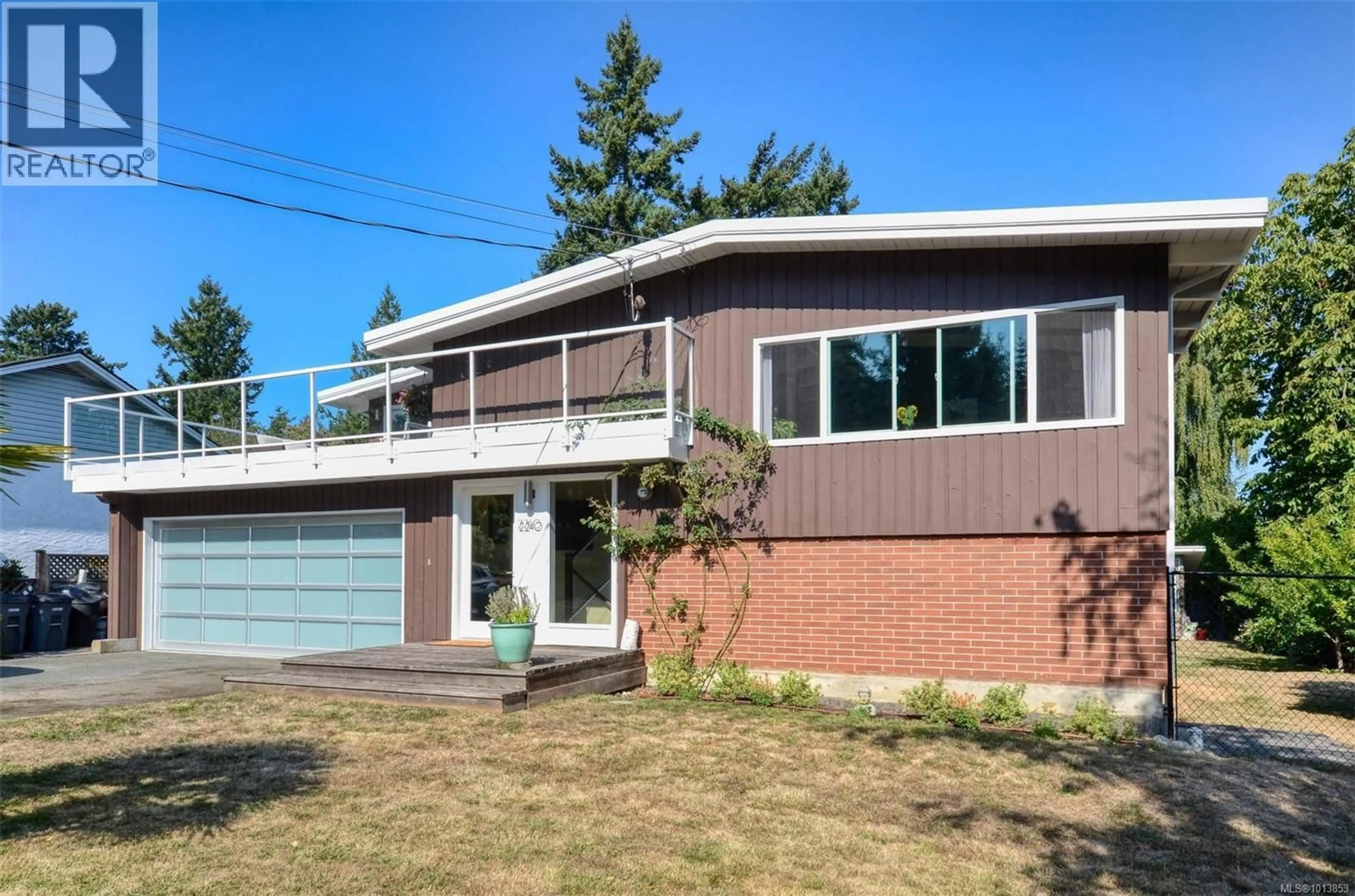 Home with vinyl exterior material, street for 2240 GREENLANDS ROAD, Saanich British Columbia V8N1T5