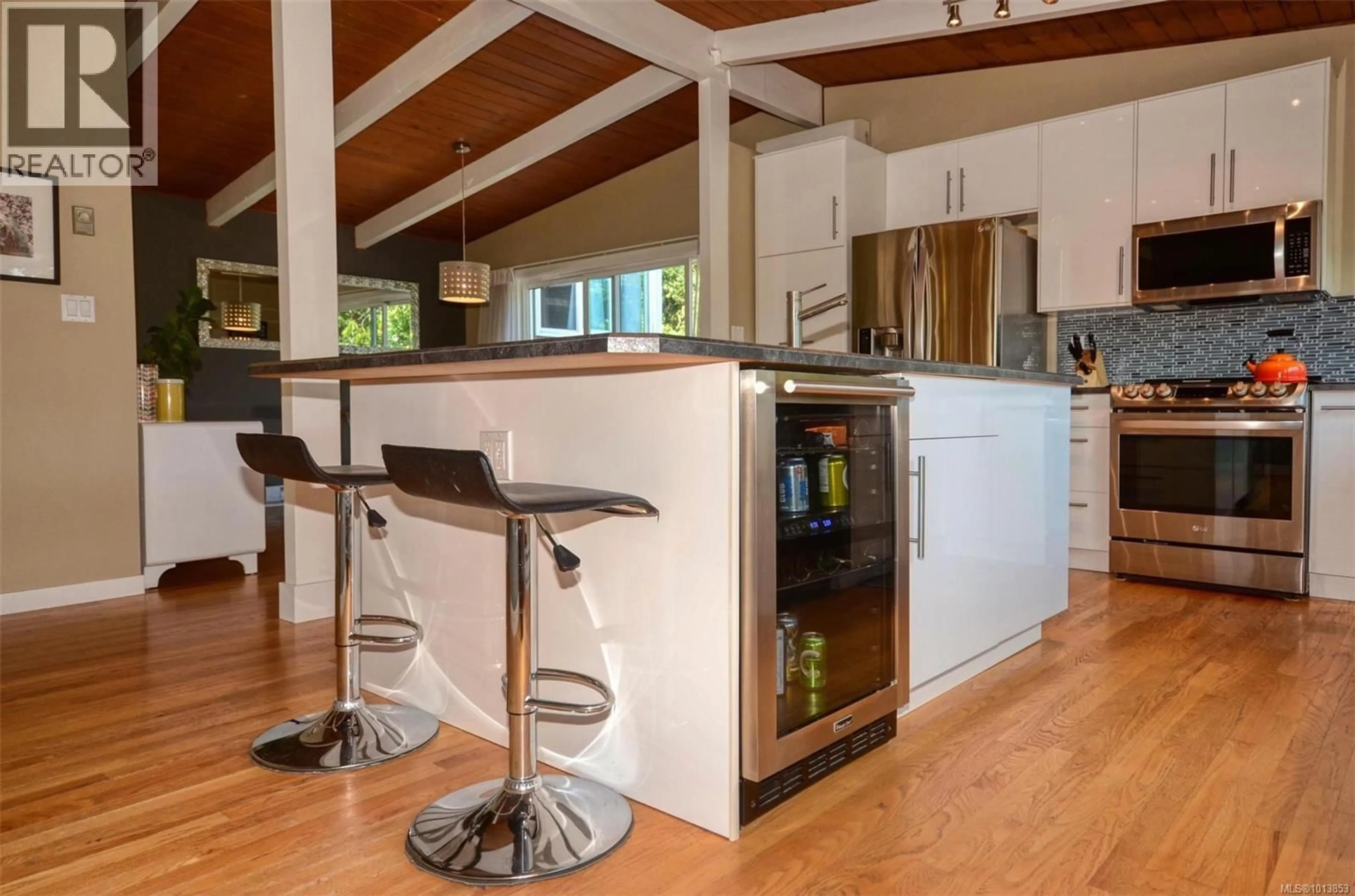 Open concept kitchen, wood/laminate floor for 2240 GREENLANDS ROAD, Saanich British Columbia V8N1T5