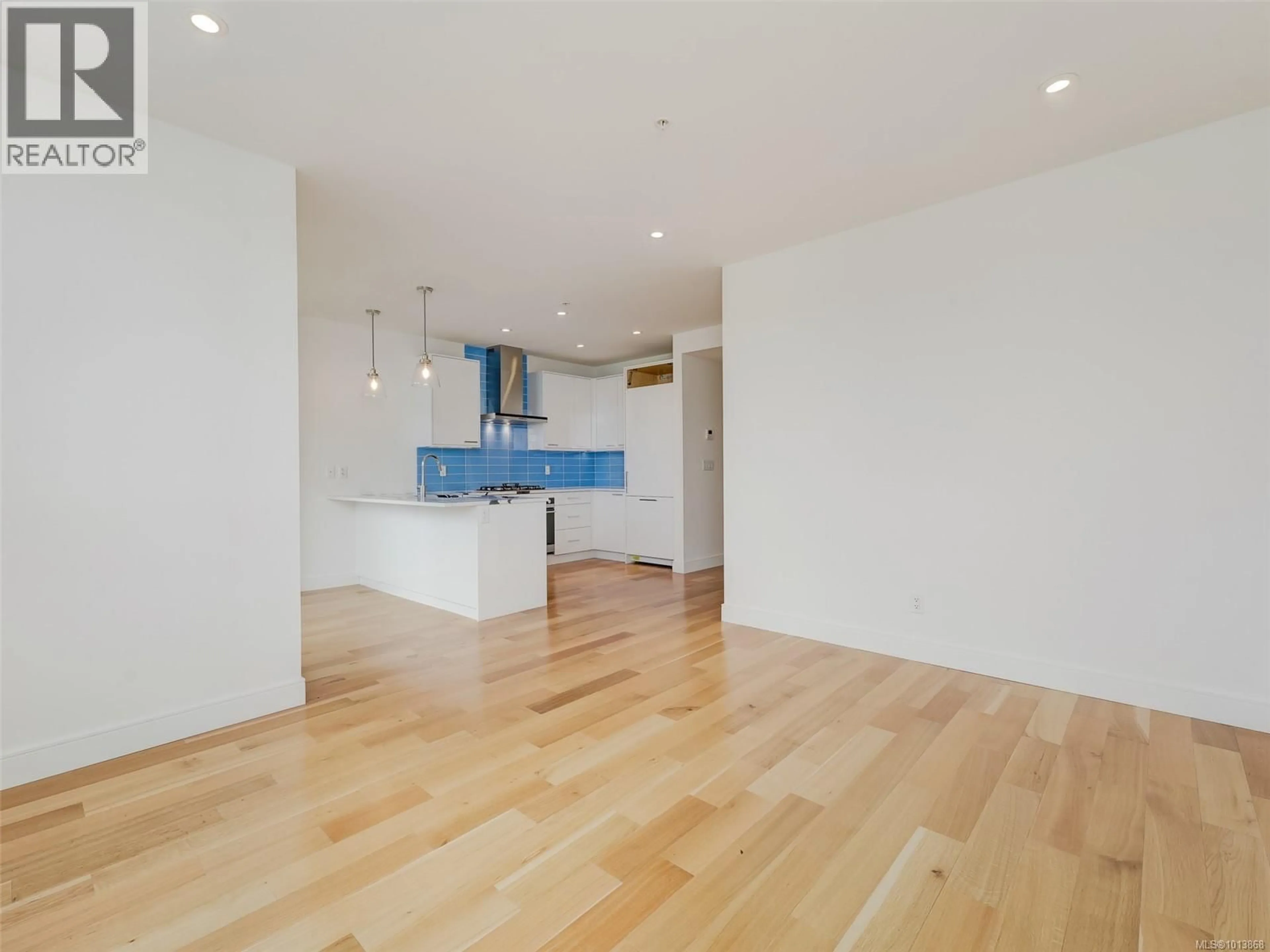 Open concept kitchen, wood/laminate floor for 207 - 916 LYALL STREET, Esquimalt British Columbia V9A5E6