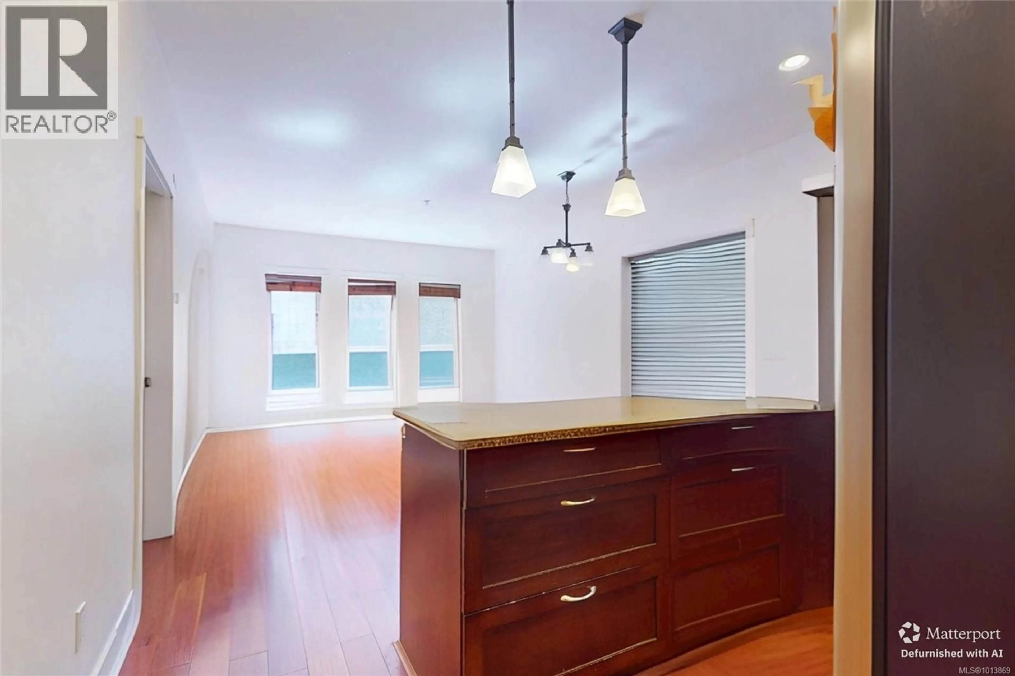 Open concept kitchen, wood/laminate floor for 103 - 201 NURSERY HILL DRIVE, View Royal British Columbia V9B0H7