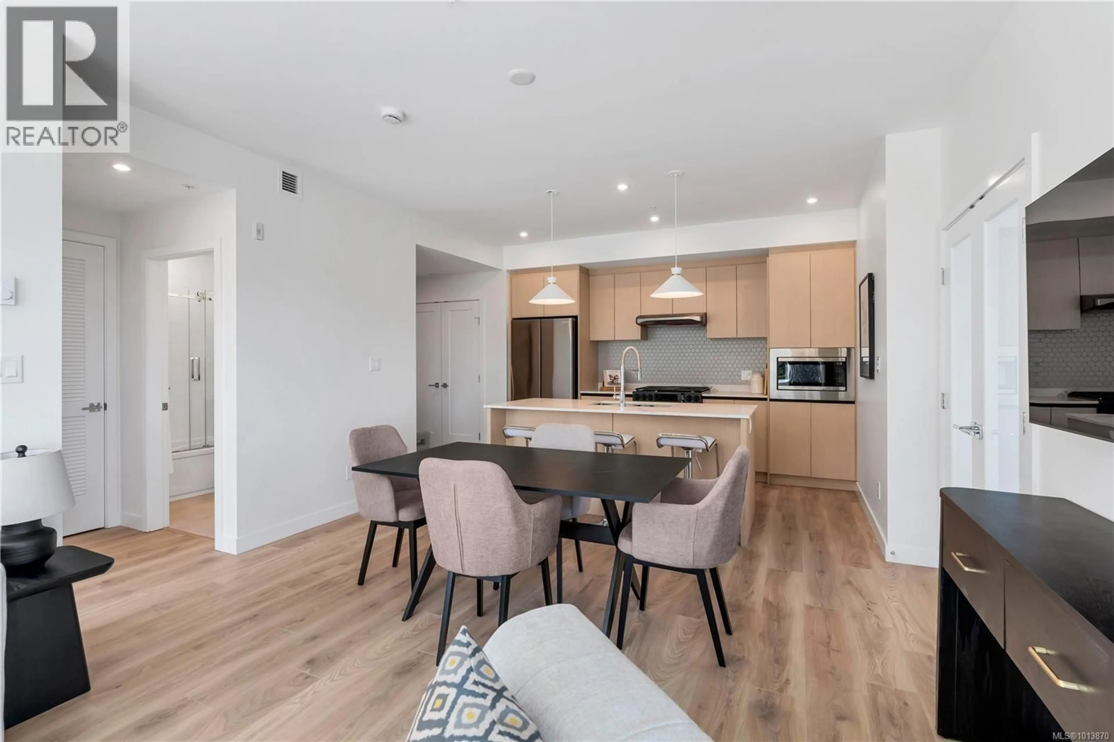Open concept kitchen, wood/laminate floor for 103 - 2000 WEST PARK LANE, View Royal British Columbia V9B3R7