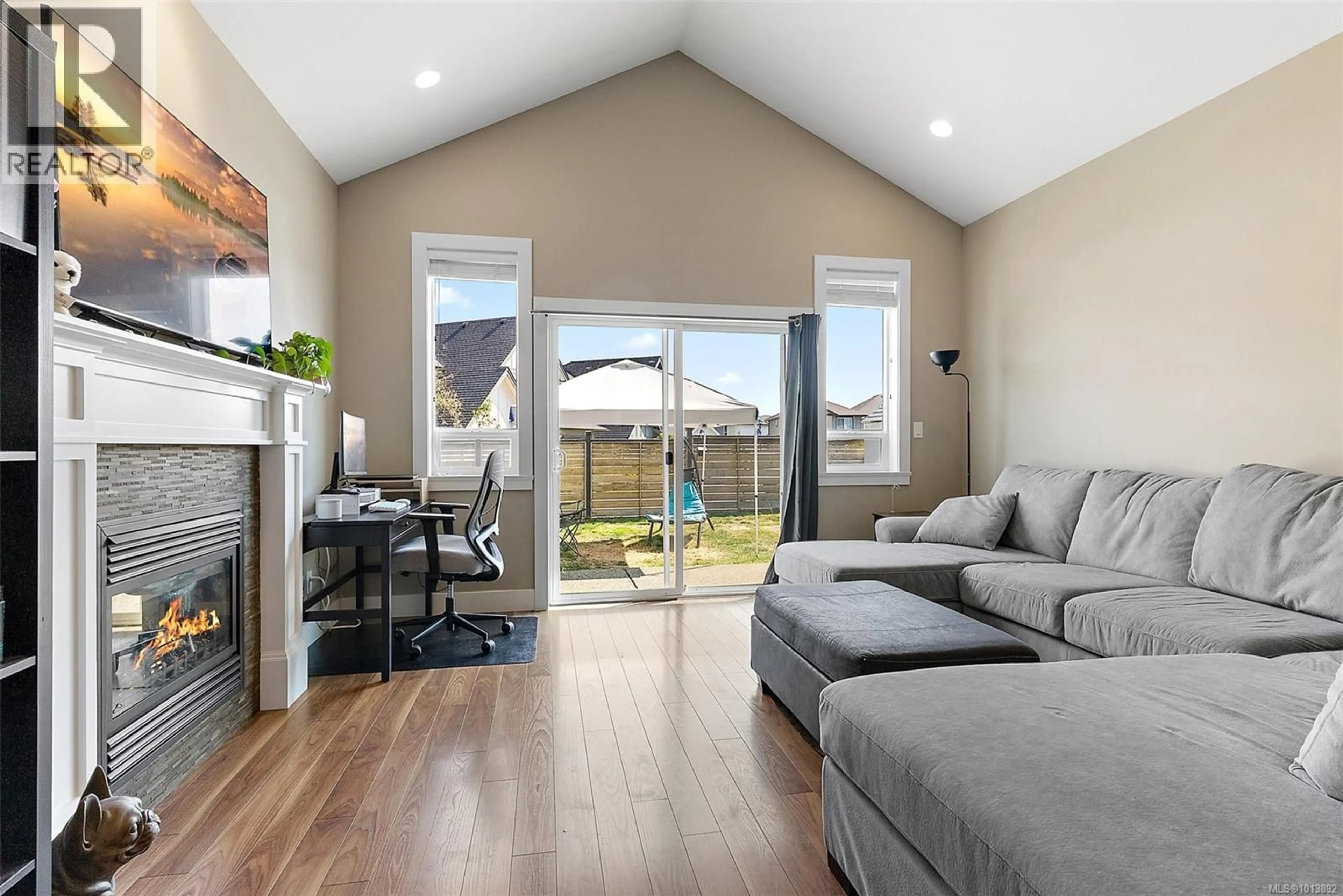 Living room with furniture, wood/laminate floor for 6539 CALLUMWOOD LANE, Sooke British Columbia V9Z0W3