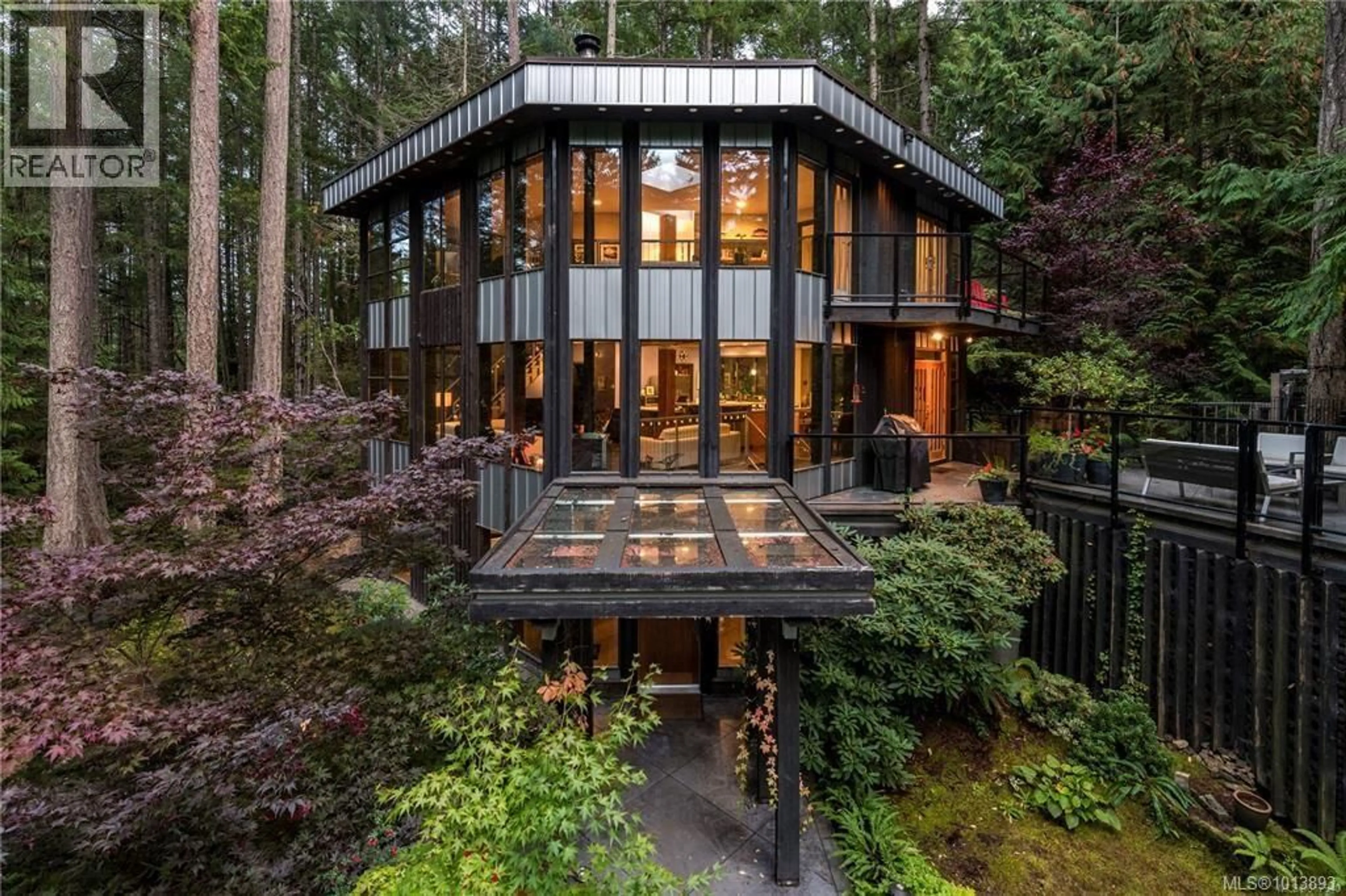 Home with brick exterior material, forest/trees view for 1457 HOWCREST ROAD, North Saanich British Columbia V8L5K1