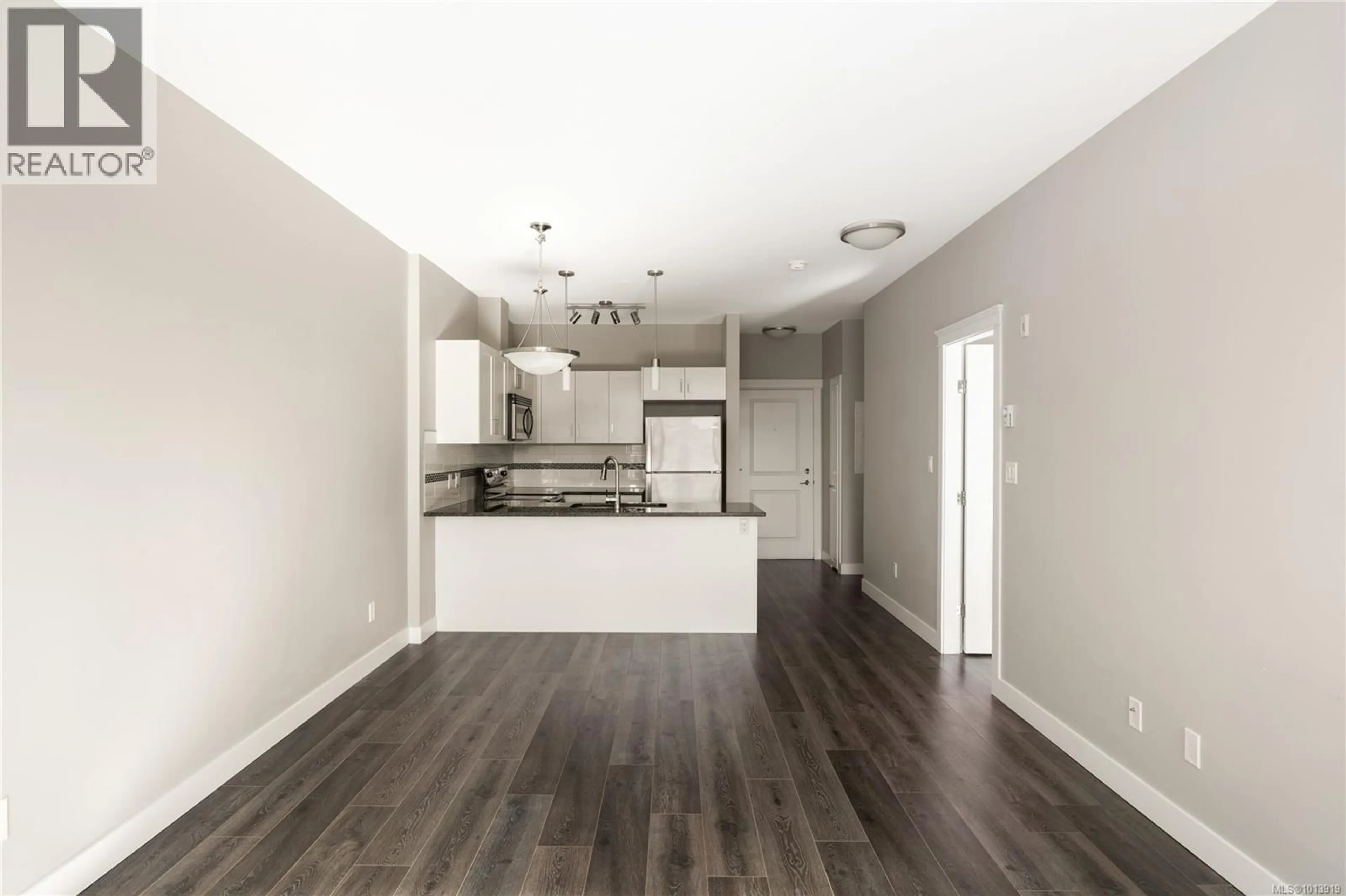 Open concept kitchen, wood/laminate floor for 406 - 844 GOLDSTREAM AVENUE, Langford British Columbia V9B2X8