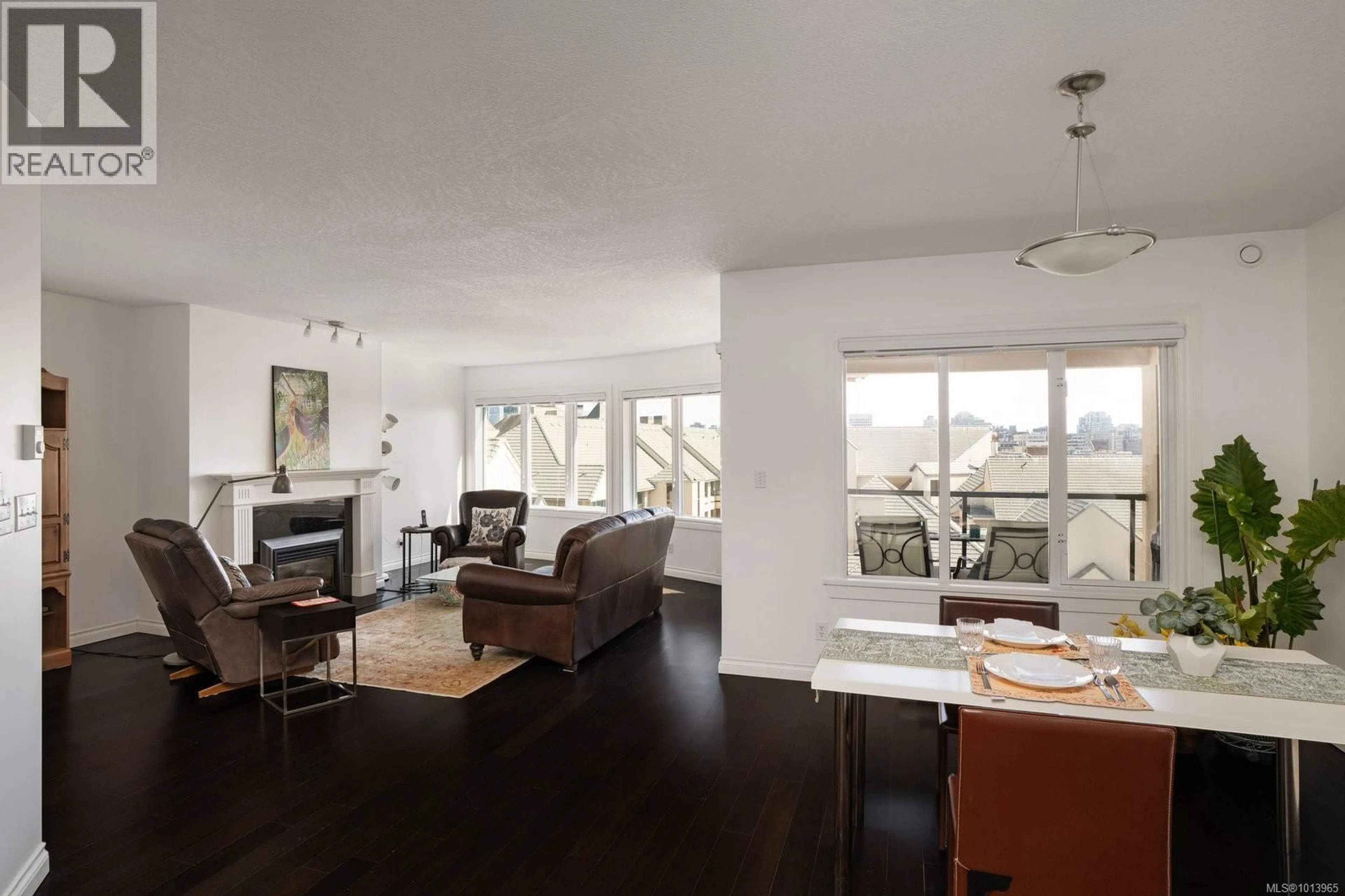 Living room with furniture, wood/laminate floor for 618 - 50 SONGHEES ROAD, Victoria British Columbia V9A7J4
