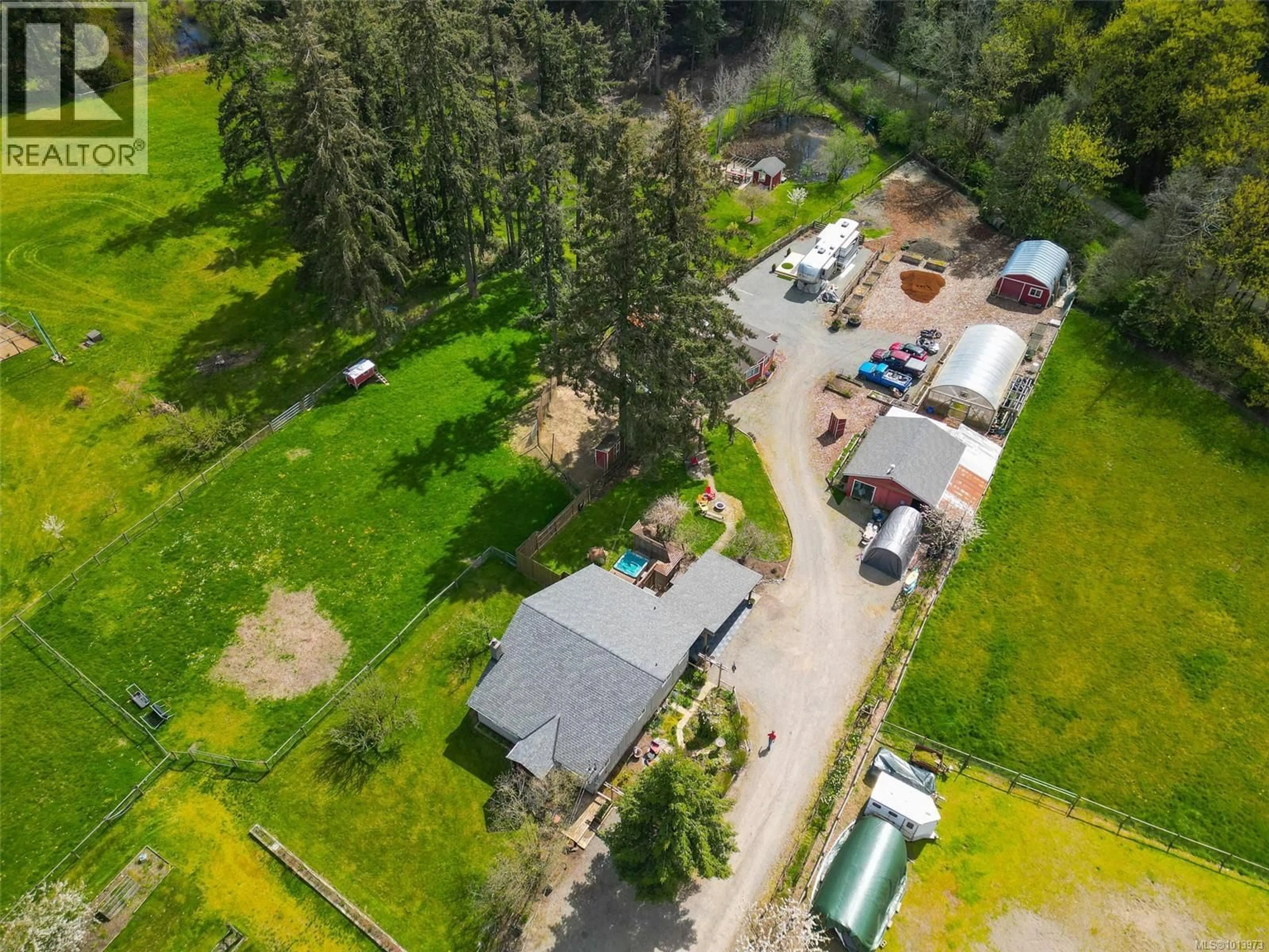 A pic from outside/outdoor area/front of a property/back of a property/a pic from drone, street for 3574 COWICHAN LAKE ROAD, Duncan British Columbia V9L6K5