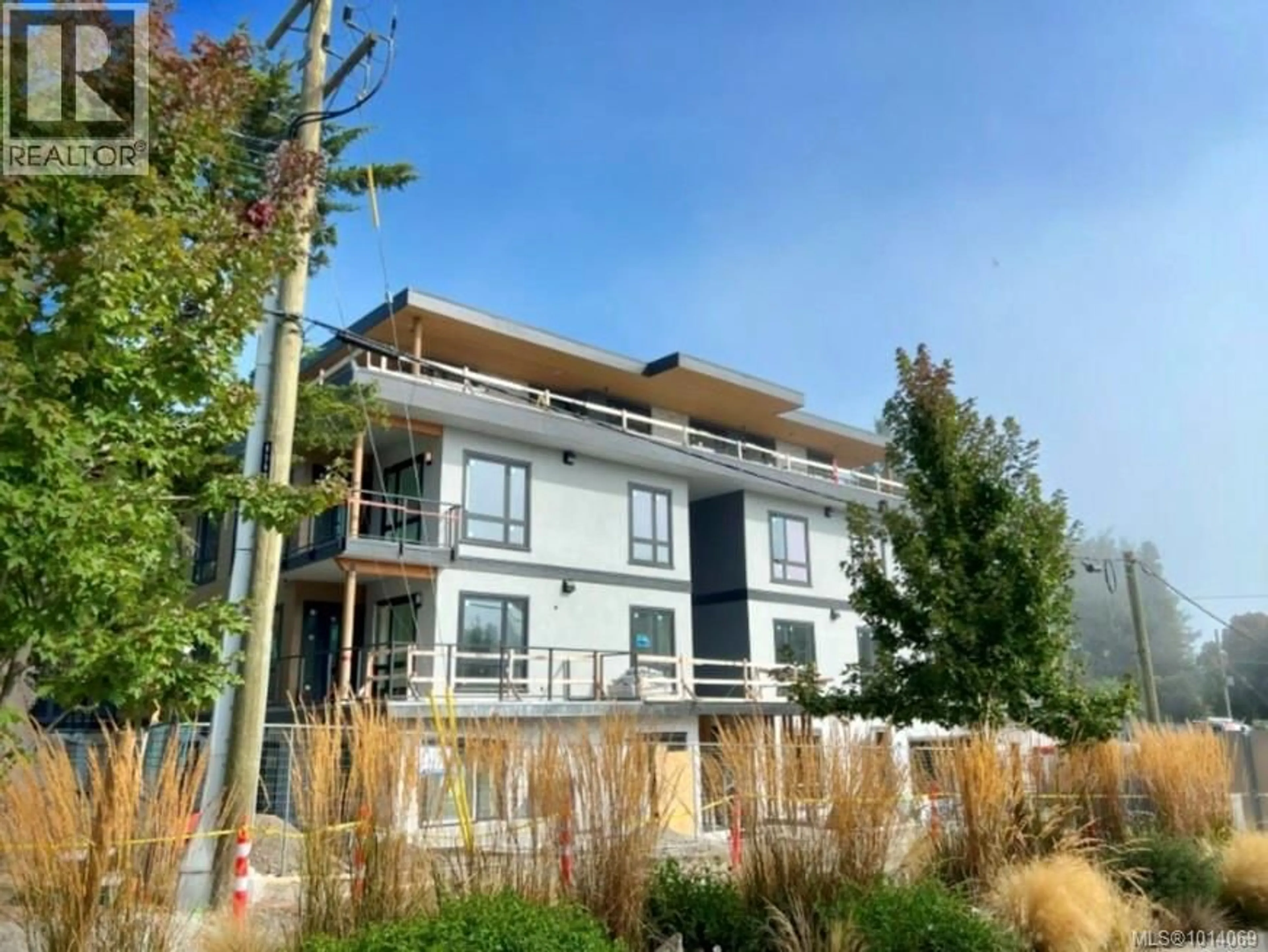 A pic from outside/outdoor area/front of a property/back of a property/a pic from drone, building for 103 - 986 DOUMAC AVENUE, Saanich British Columbia V8Y1M4