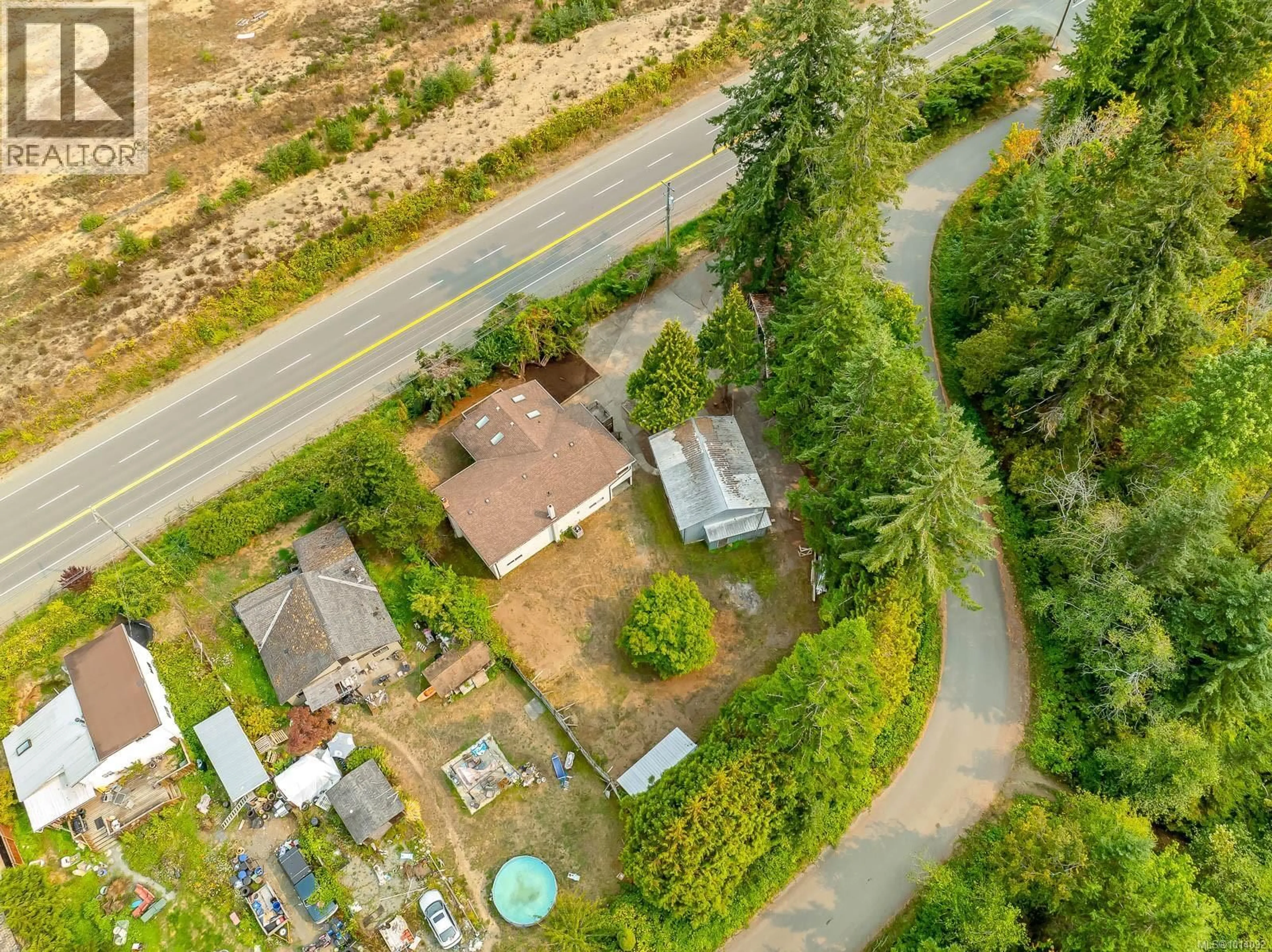 A pic from outside/outdoor area/front of a property/back of a property/a pic from drone, street for 5303 ISLAND HIGHWAY SOUTH, Union Bay British Columbia V0R3B0