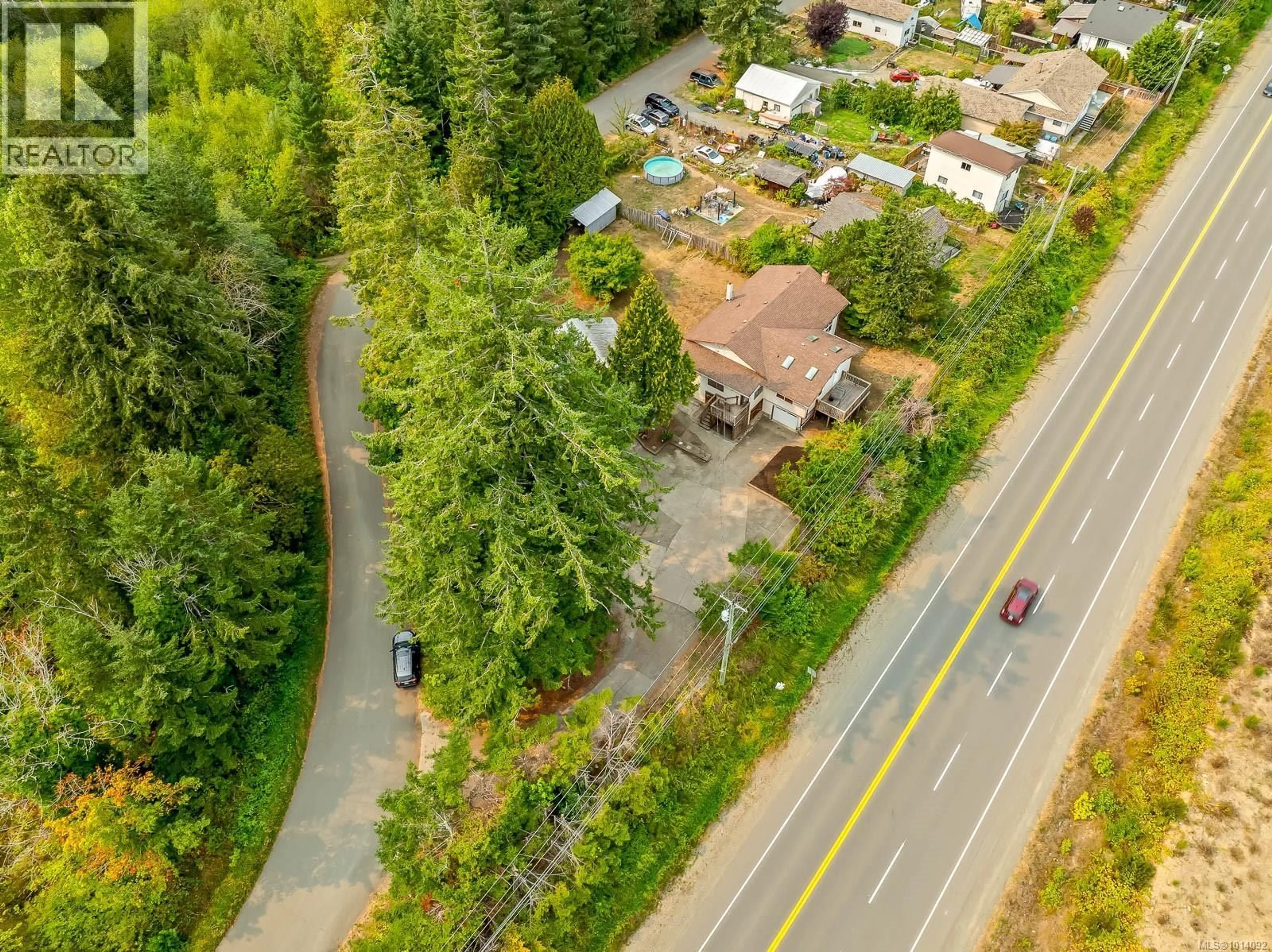 A pic from outside/outdoor area/front of a property/back of a property/a pic from drone, forest/trees view for 5303 ISLAND HIGHWAY SOUTH, Union Bay British Columbia V0R3B0