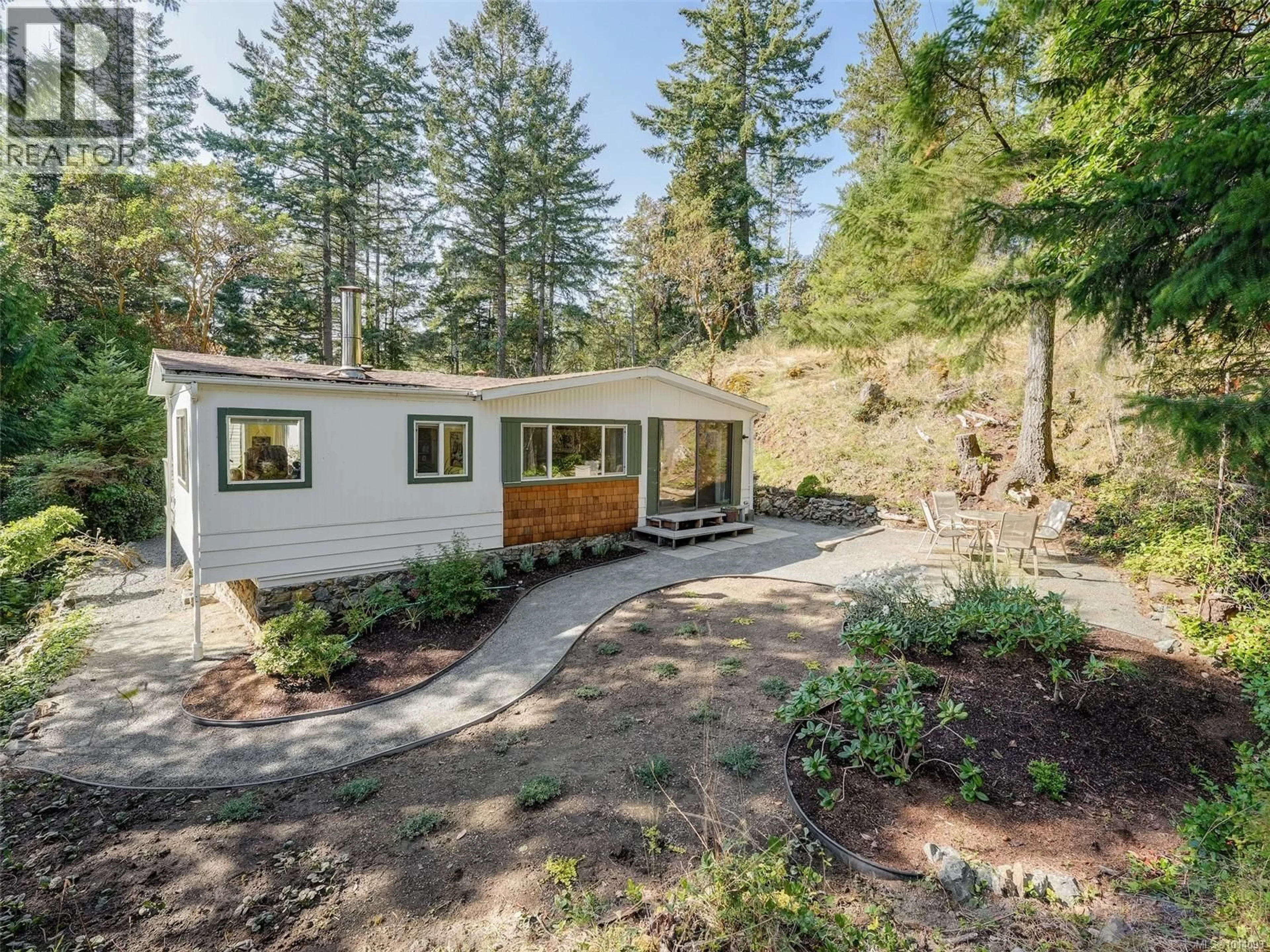 A pic from outside/outdoor area/front of a property/back of a property/a pic from drone, forest/trees view for 97 - 5838 BLYTHWOOD ROAD, Sooke British Columbia V9Z1G1