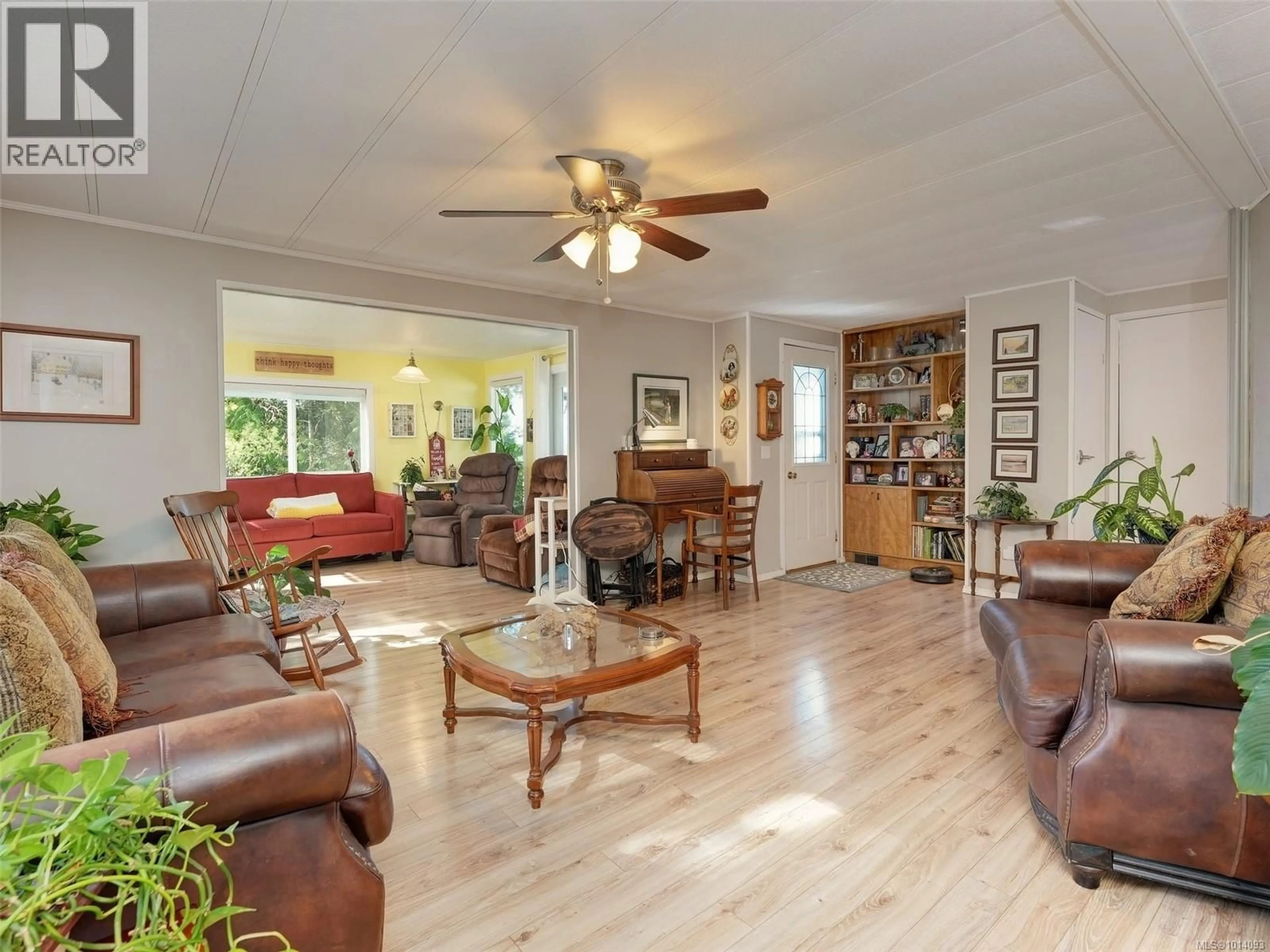 Living room with furniture, wood/laminate floor for 97 - 5838 BLYTHWOOD ROAD, Sooke British Columbia V9Z1G1