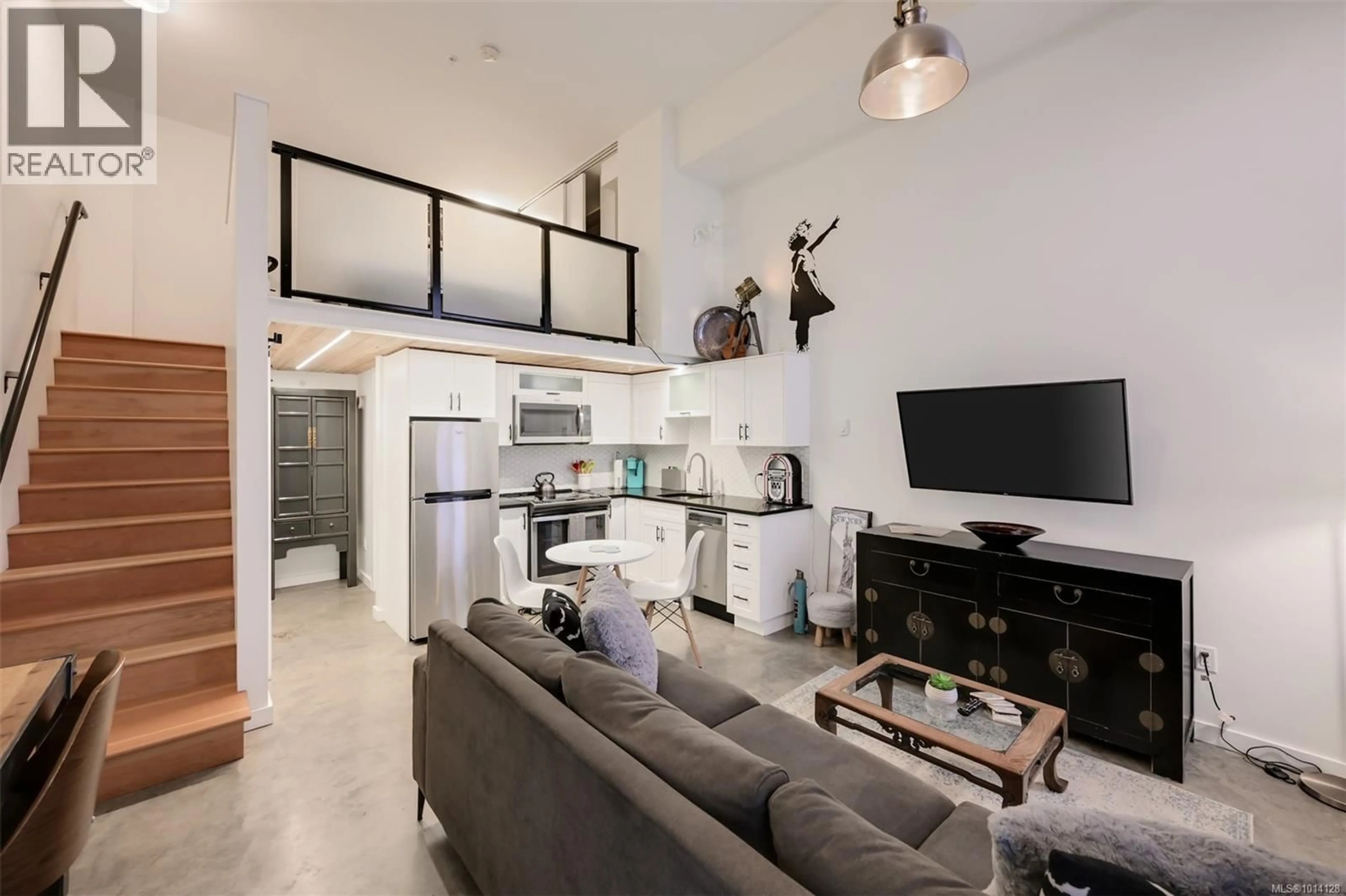 Open concept kitchen, cement floor for 103 - 534 PANDORA AVENUE, Victoria British Columbia V8W1N6