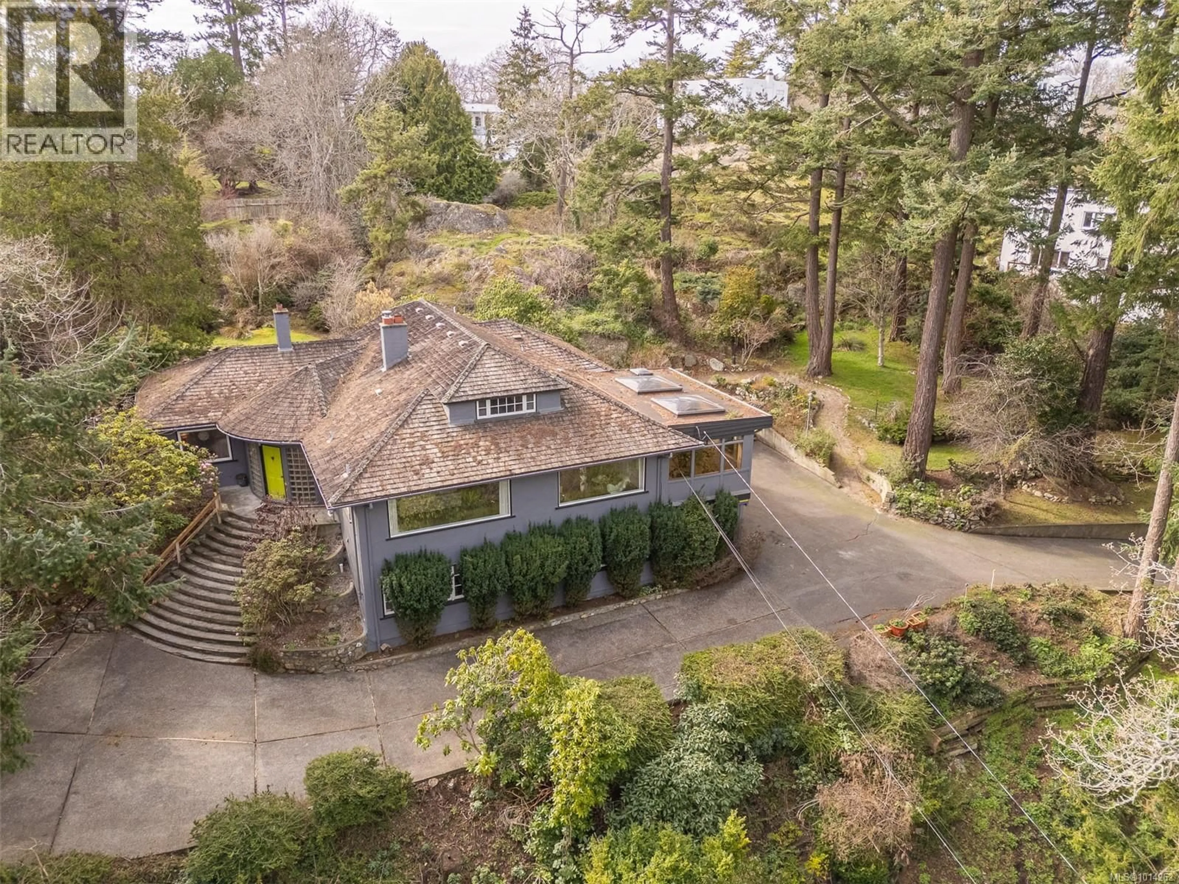 A pic from outside/outdoor area/front of a property/back of a property/a pic from drone, forest/trees view for 52 SYLVAN LANE, Oak Bay British Columbia V8S2K8