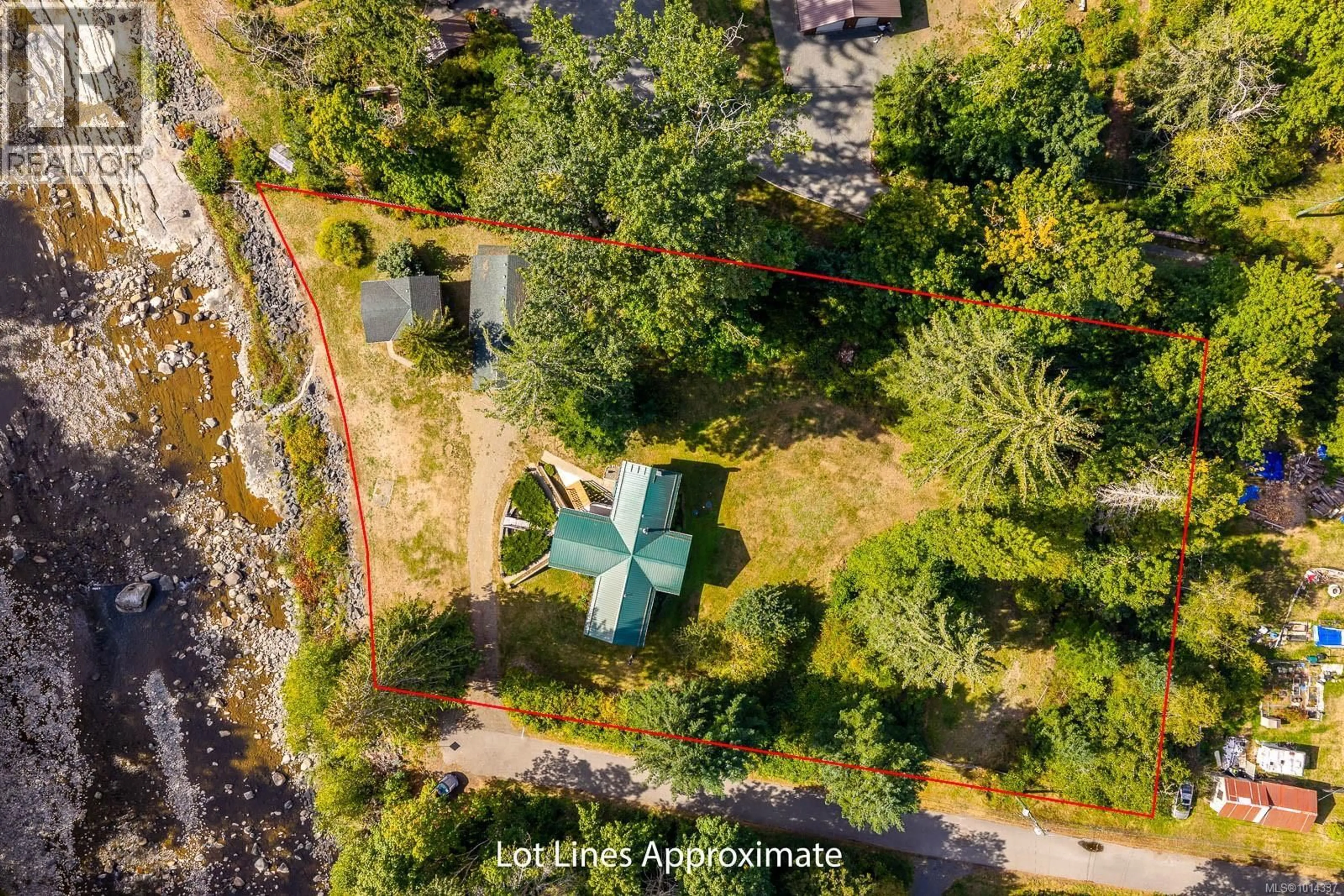 A pic from outside/outdoor area/front of a property/back of a property/a pic from drone, forest/trees view for 4867 LORNA LANE, Campbell River British Columbia V9H1C9