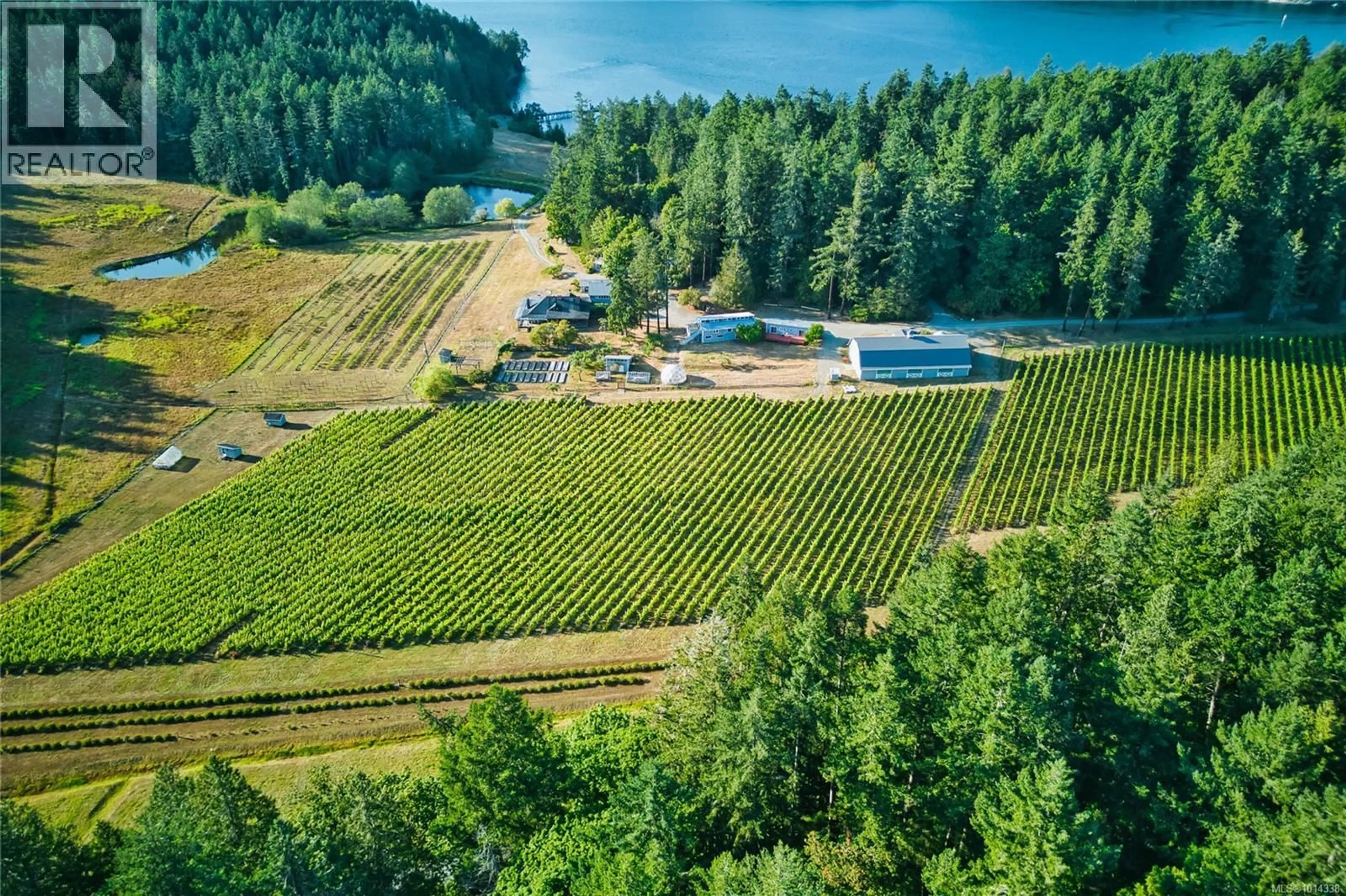 A pic from outside/outdoor area/front of a property/back of a property/a pic from drone, water/lake/river/ocean view for 3200 CLAM BAY ROAD, Pender Island British Columbia V0M2M1