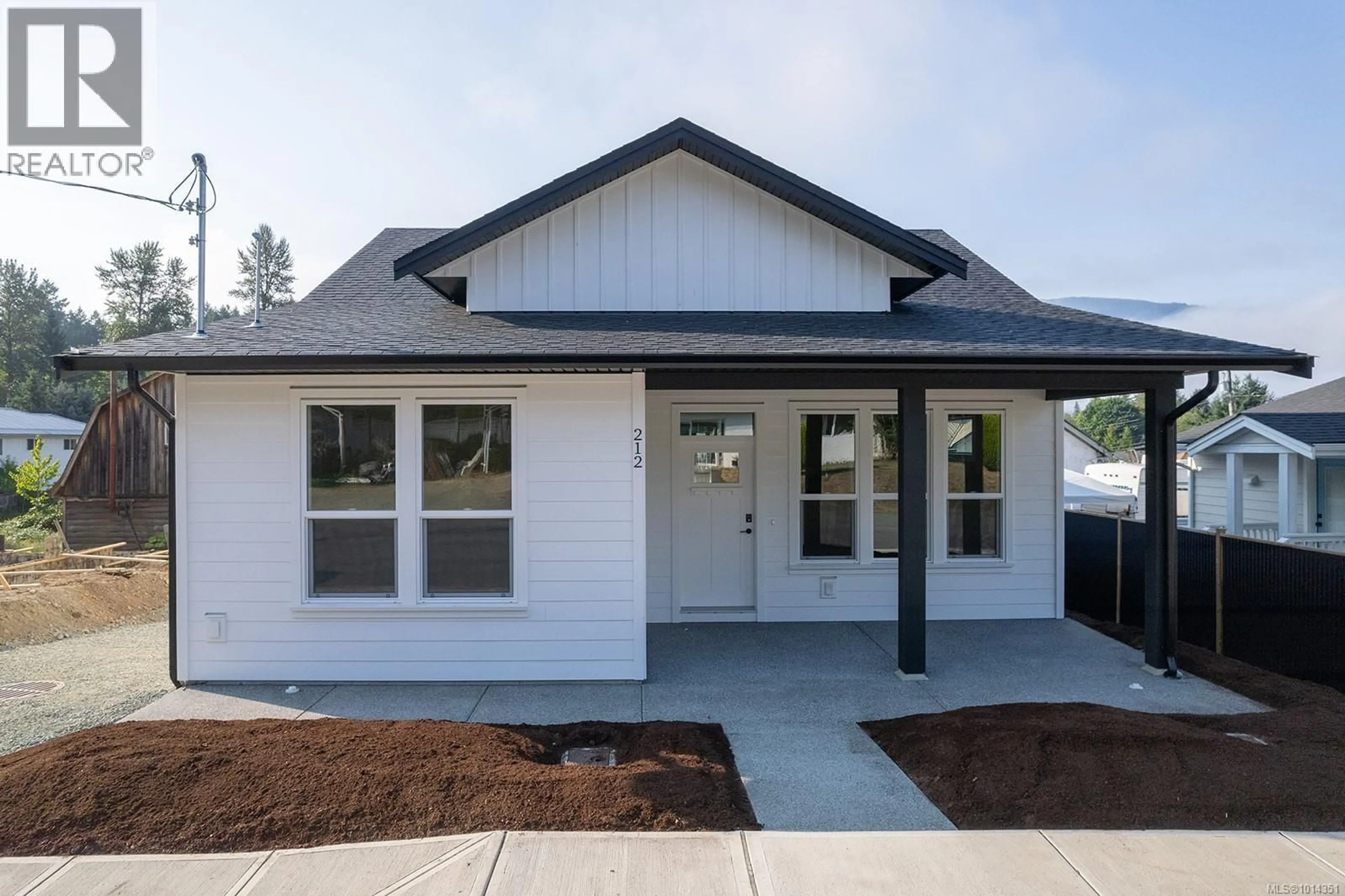 Home with vinyl exterior material, street for 212 OAK LANE, Lake Cowichan British Columbia V0R2G0