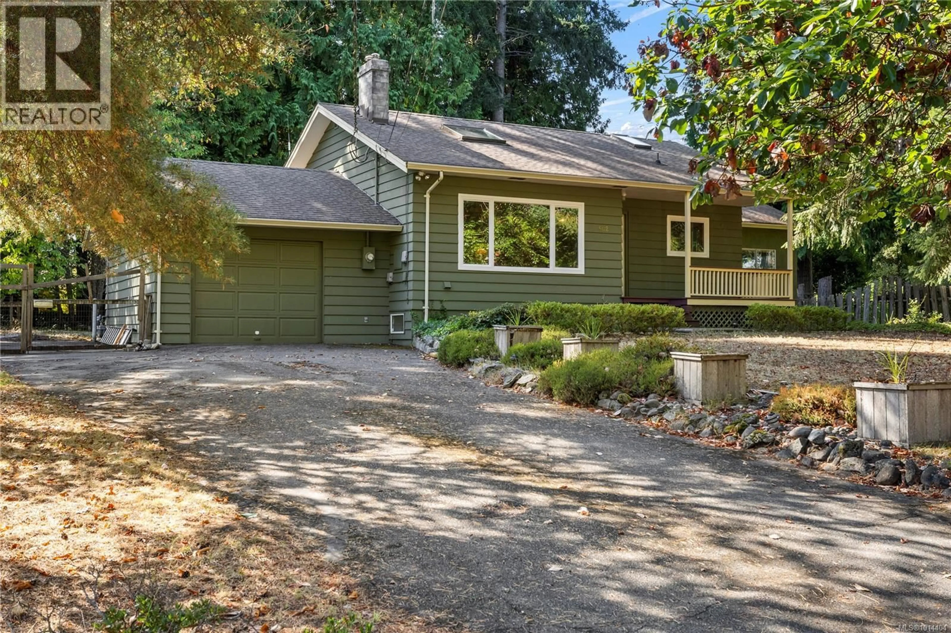 Home with vinyl exterior material, street for 502 QUATNA ROAD, Qualicum Beach British Columbia V9K1B4