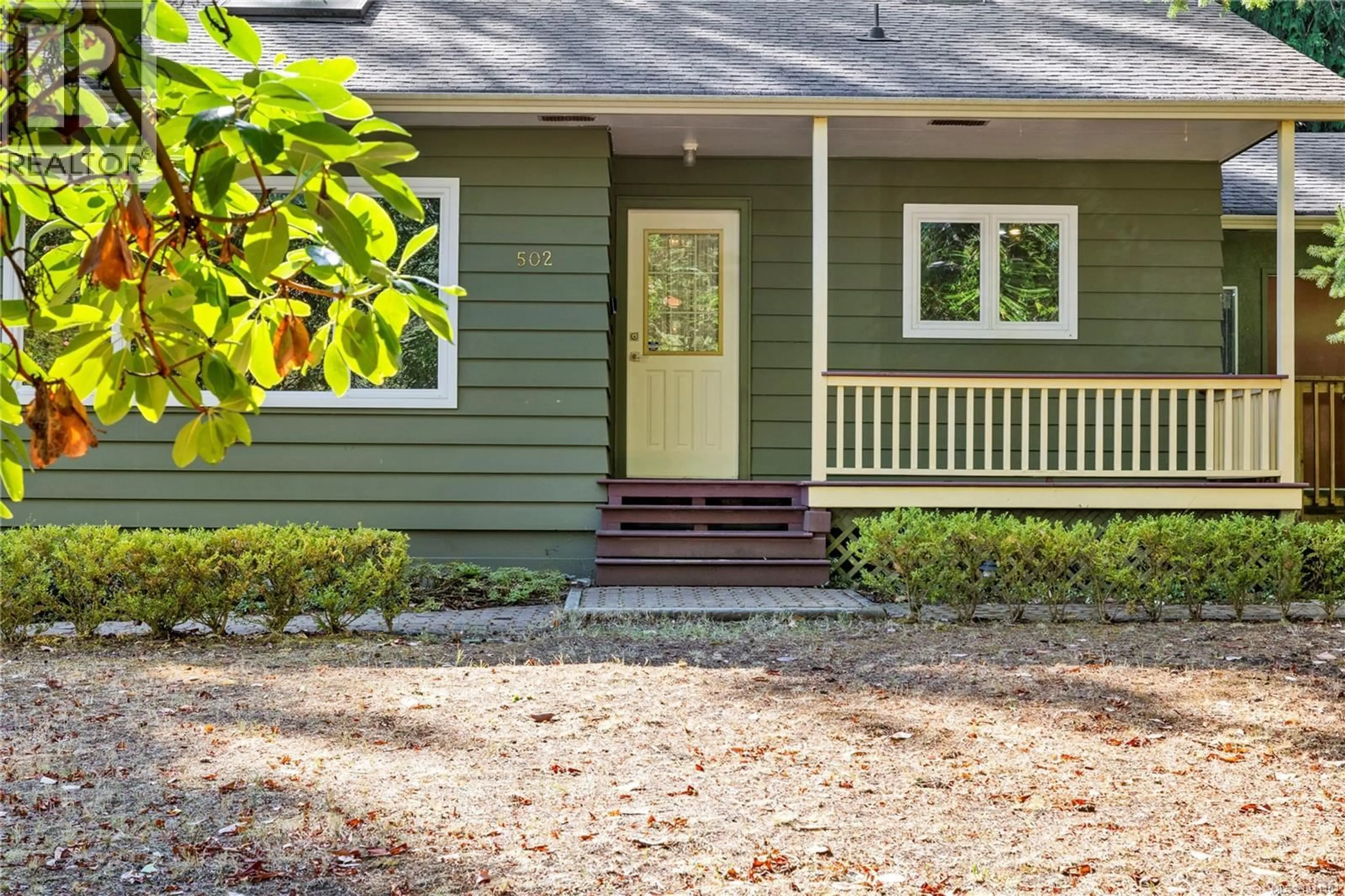 Home with vinyl exterior material, street for 502 QUATNA ROAD, Qualicum Beach British Columbia V9K1B4