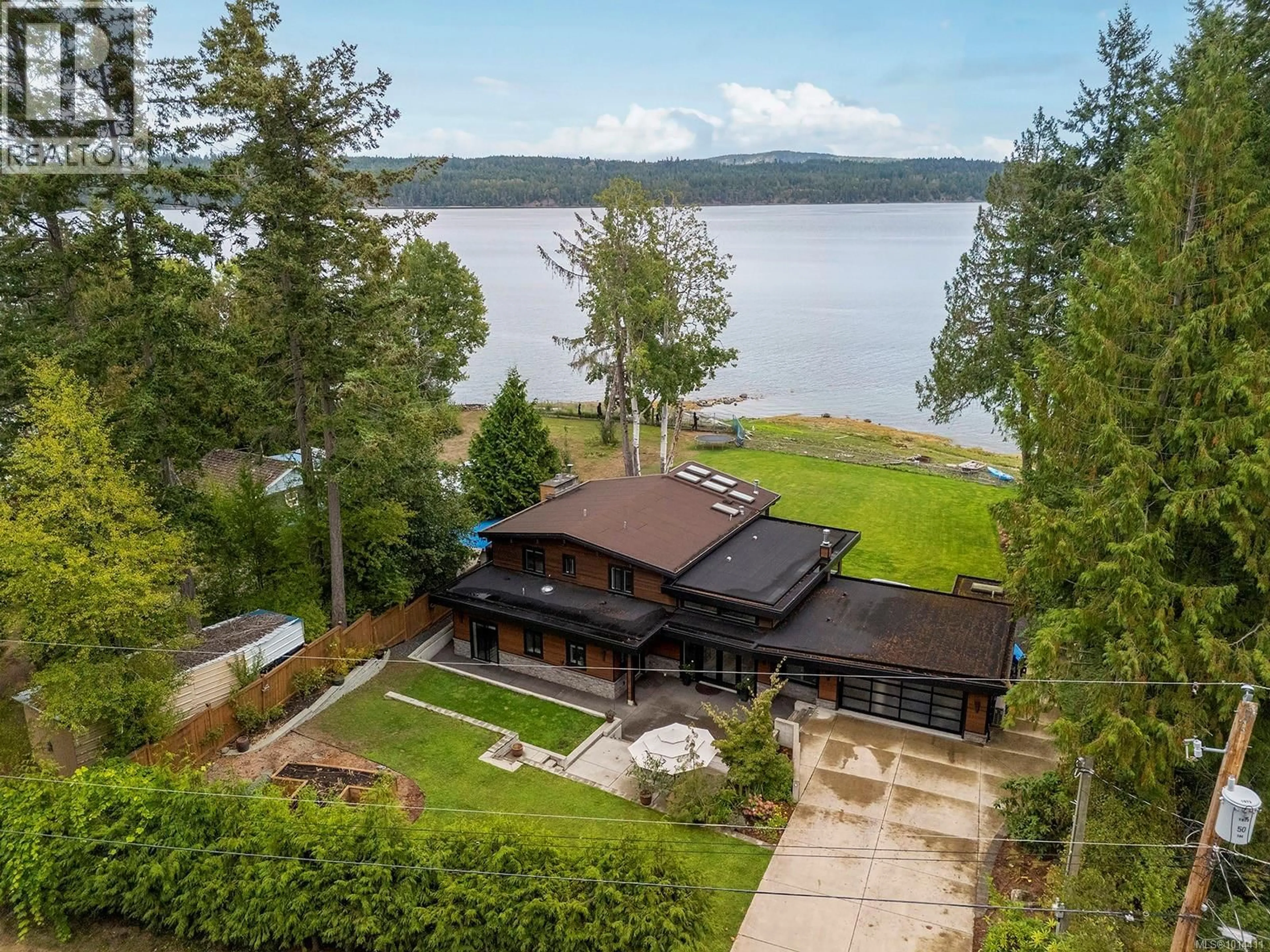A pic from outside/outdoor area/front of a property/back of a property/a pic from drone, water/lake/river/ocean view for 154 BAYNES DRIVE, Fanny Bay British Columbia V0R1W0
