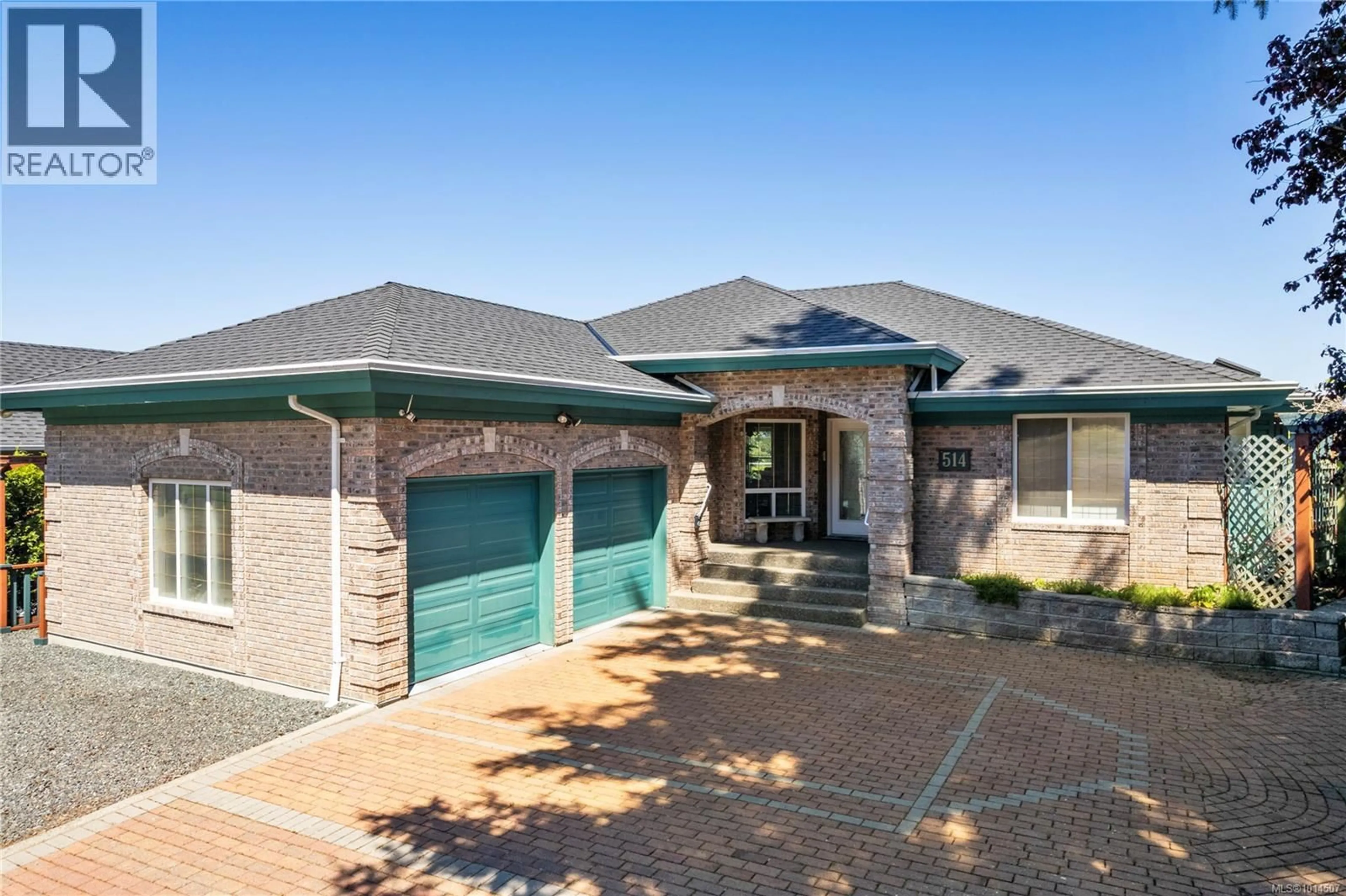 Home with brick exterior material, street for 514 COUNTRY CLUB DRIVE, Qualicum Beach British Columbia V9K2J9