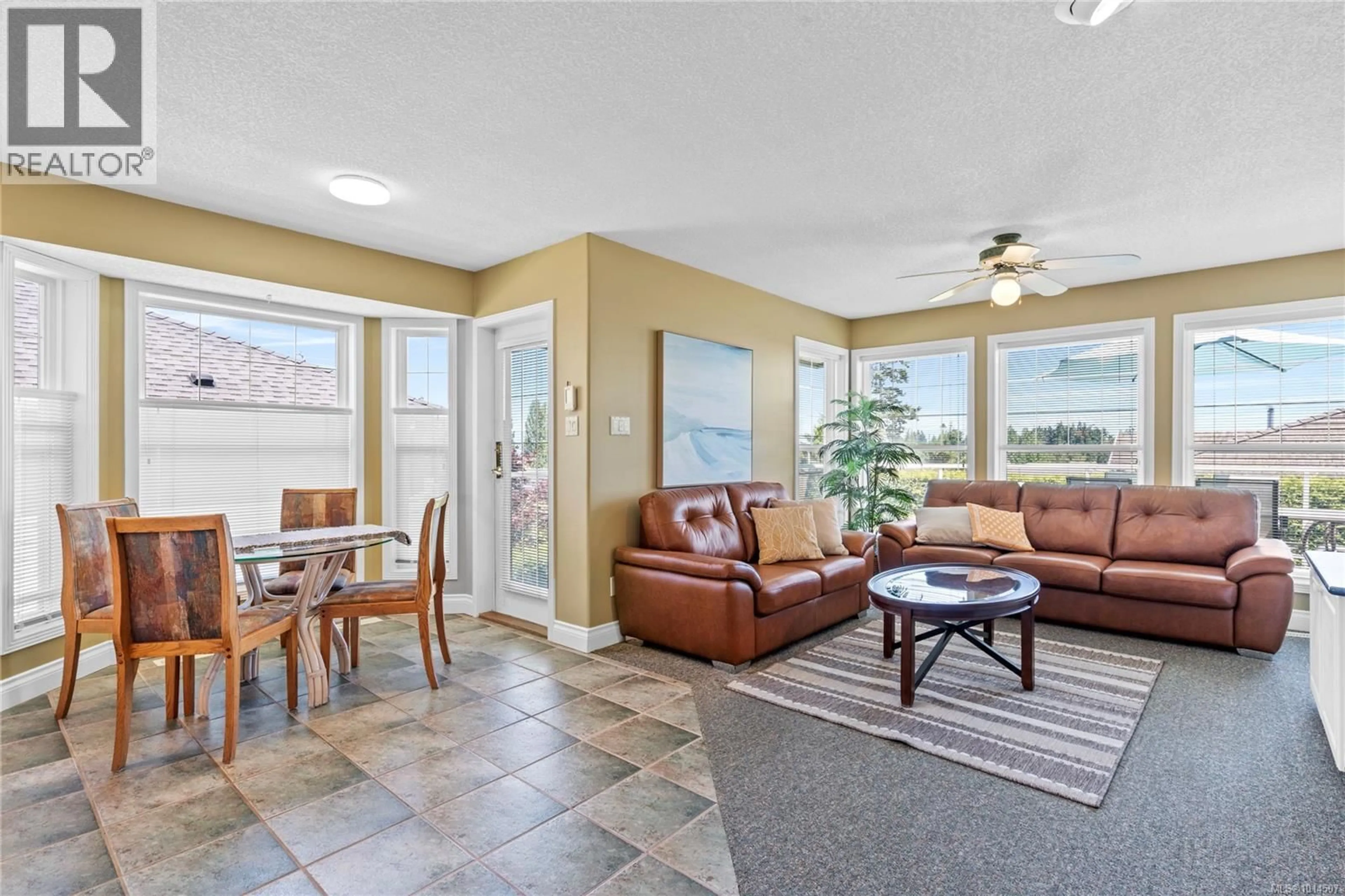 Living room with furniture, ceramic/tile floor for 514 COUNTRY CLUB DRIVE, Qualicum Beach British Columbia V9K2J9