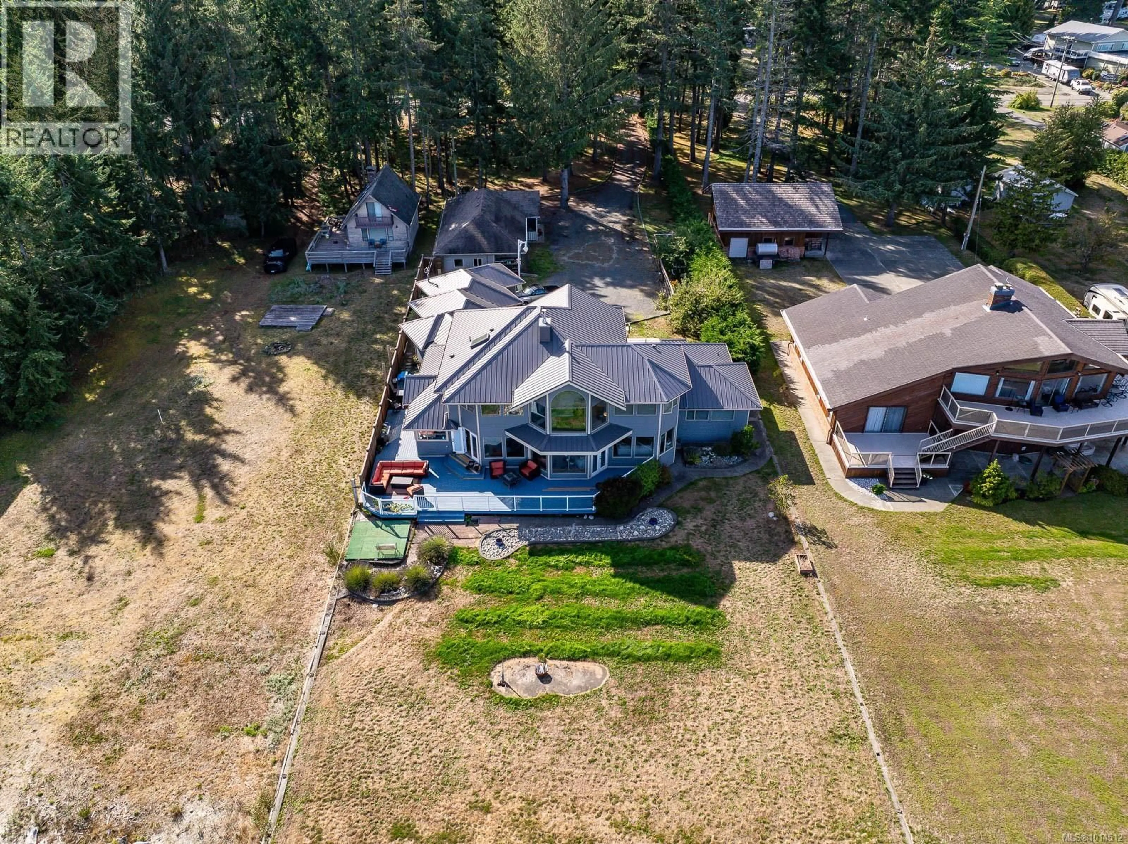 A pic from outside/outdoor area/front of a property/back of a property/a pic from drone, water/lake/river/ocean view for 9060 CLARKSON AVENUE, Black Creek British Columbia V9J1B3
