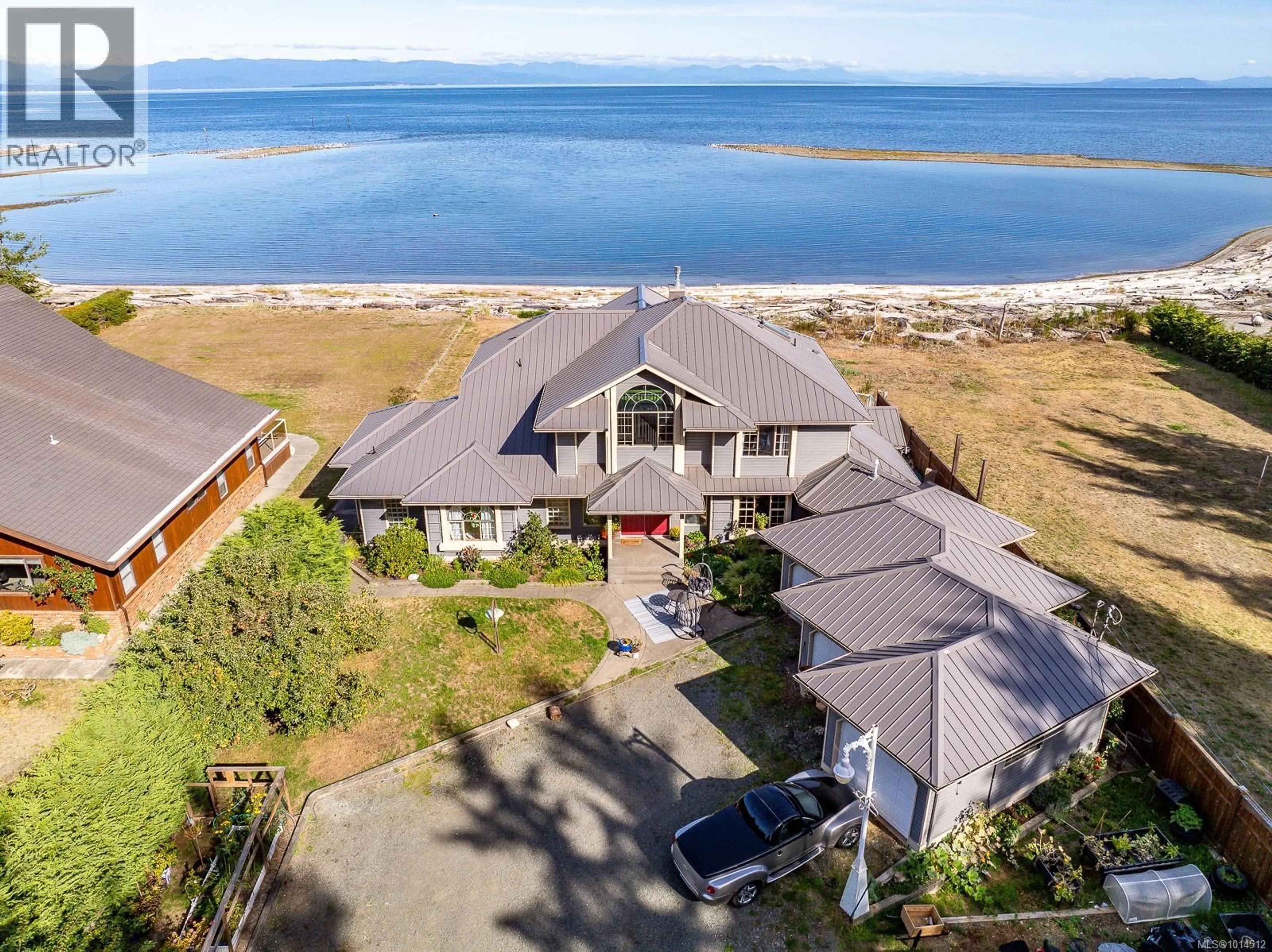 A pic from outside/outdoor area/front of a property/back of a property/a pic from drone, water/lake/river/ocean view for 9060 CLARKSON AVENUE, Black Creek British Columbia V9J1B3