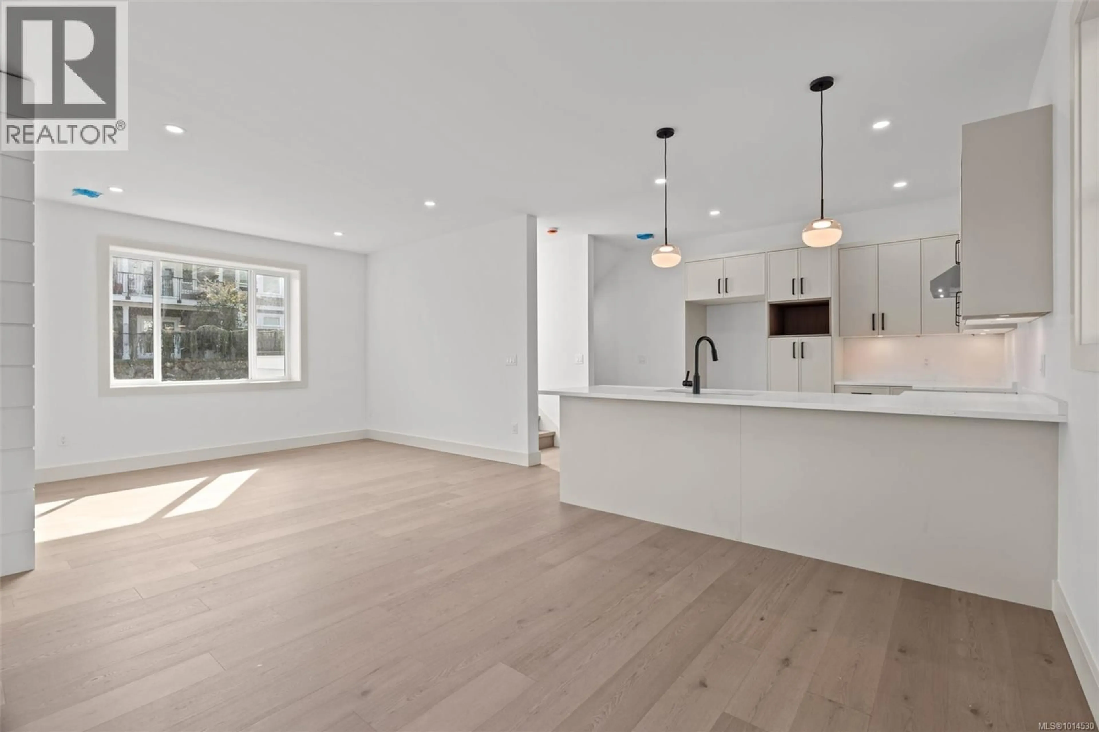 Open concept kitchen, wood/laminate floor for 1 - 571 BEZANTON WAY, Colwood British Columbia V9C0H2