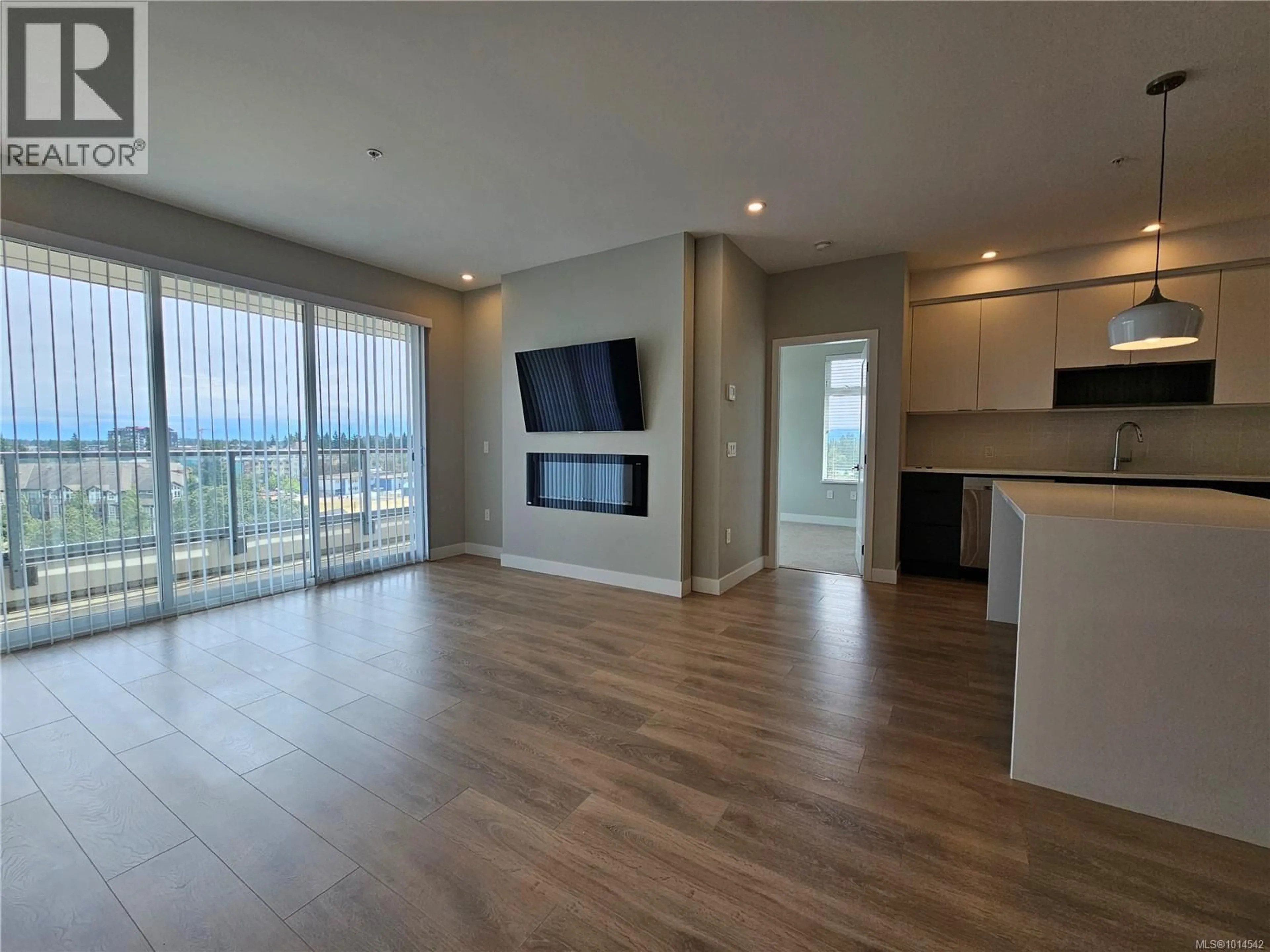 Living room with furniture, wood/laminate floor for 513 - 967 WHIRLAWAY CRESCENT, Langford British Columbia V9B0Y1
